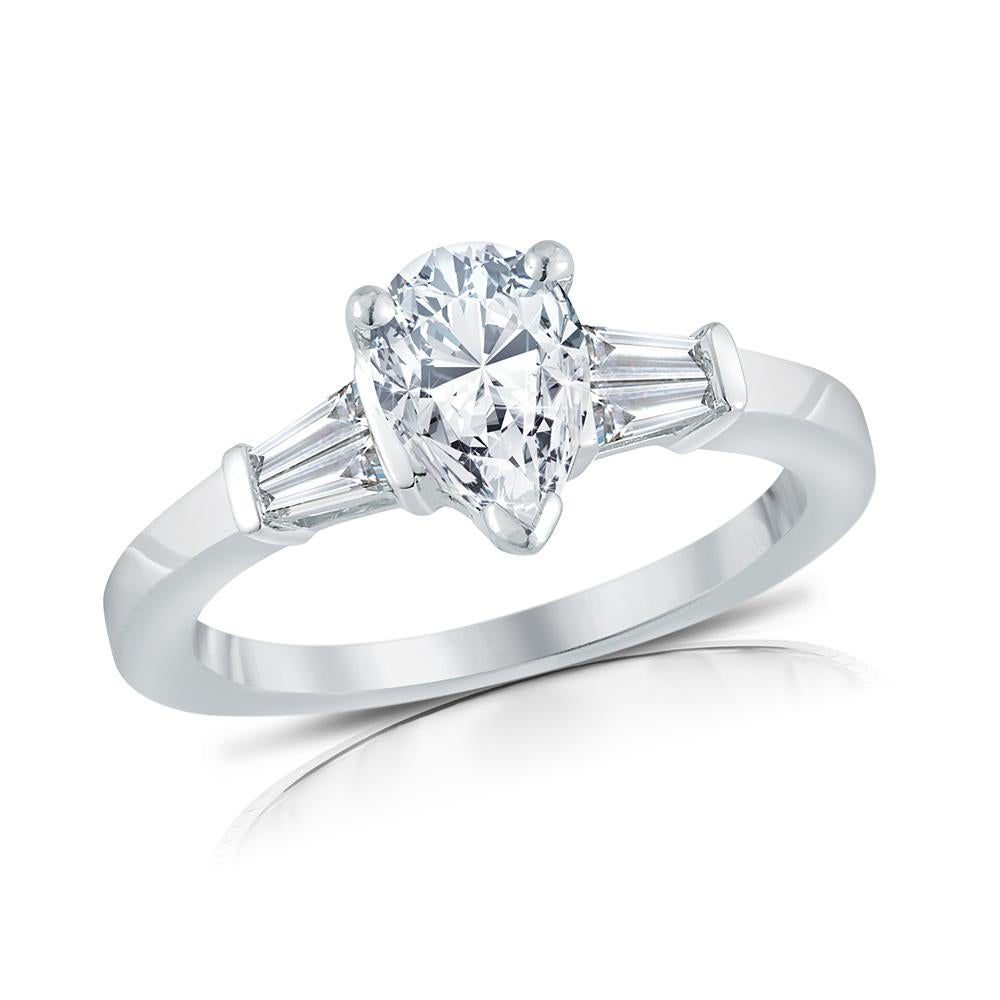 Diamond Engagement ring, made of Platinum, set with Pear Shaped Diamond, weight 1.00C. G color VS1 clarity, GIA Certified and tapered Baguette shaped Diamonds weight 0.30C.G color VS1 clarity.