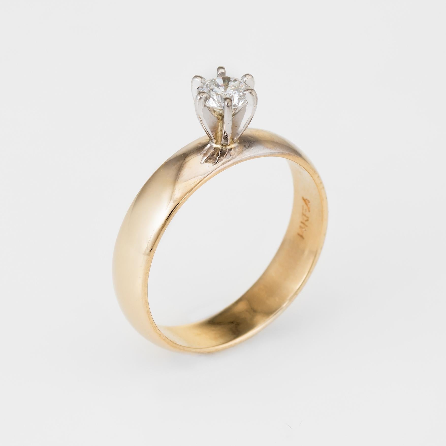 Elegant diamond engagement ring, crafted in 14 karat yellow gold. 

Round brilliant cut diamond is estimated at 0.25 carats (estimated at H-I color and SI1 clarity), set into a six pronged mount.  

The ring is in excellent condition.