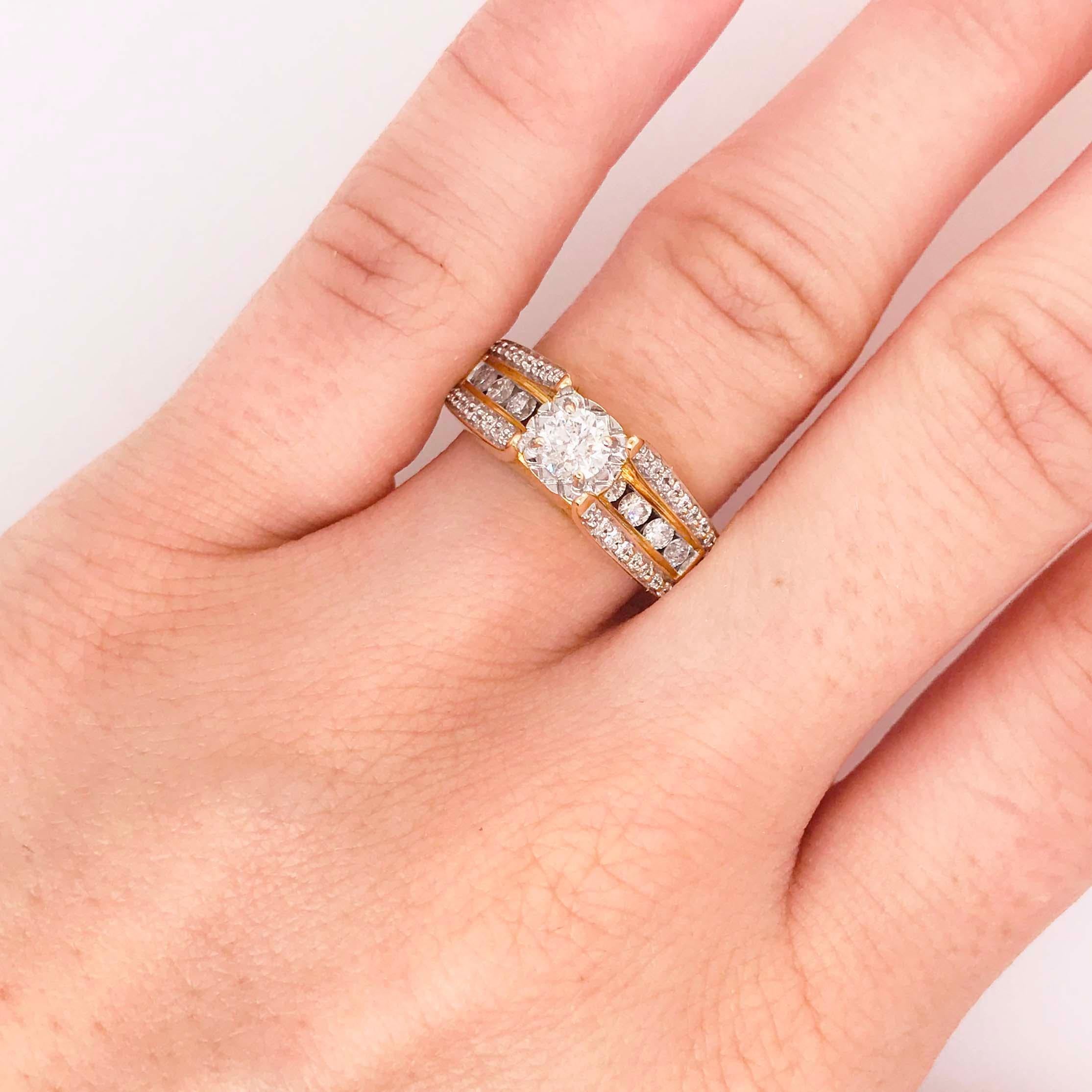 This diamond engagement ring is a custom diamond ring! With a round brilliant diamond set in the center. This diamond engagement ring has a bold diamond band design that is special to this piece. The band has a round diamond, channel set that goes