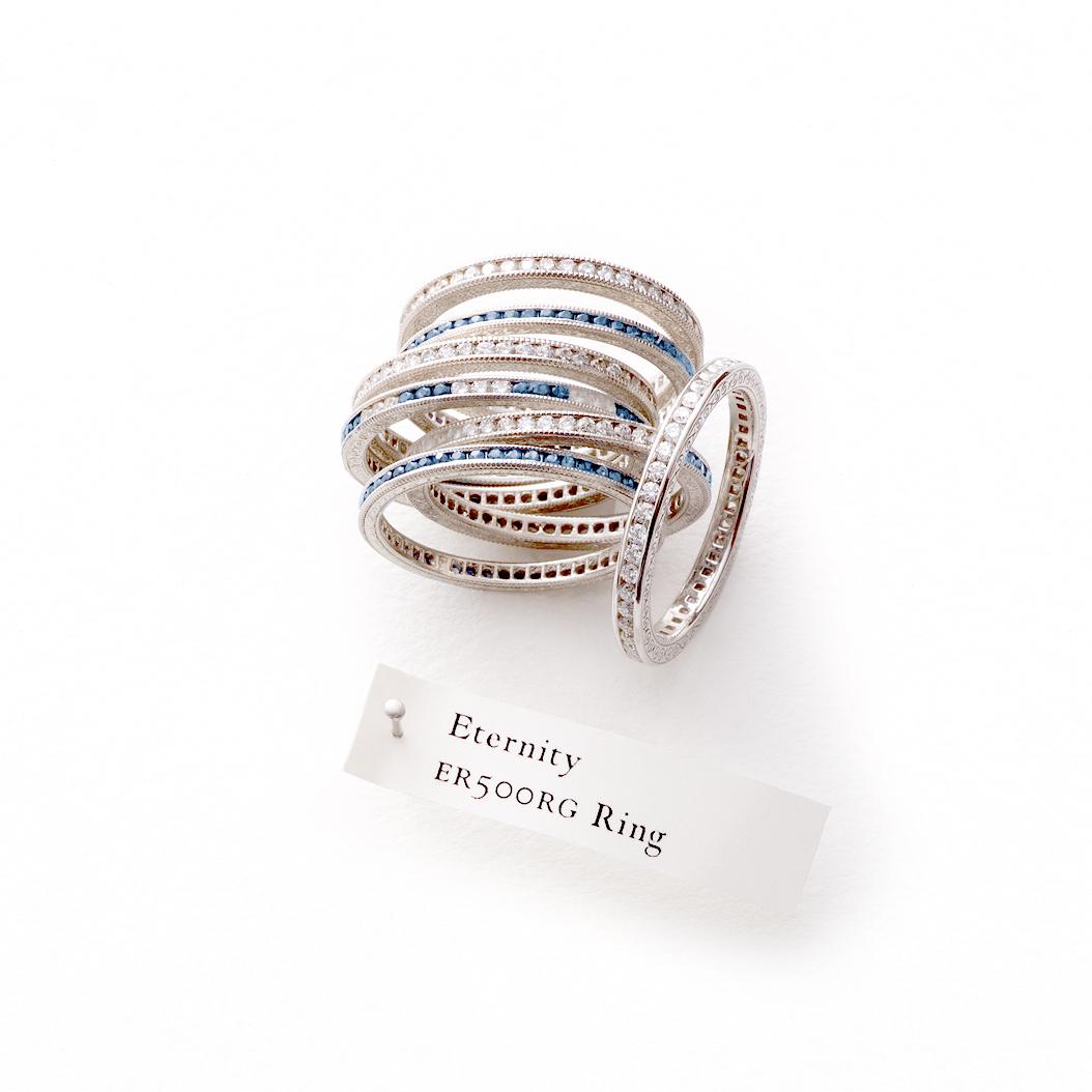 Celebrate eternal love and cherished moments with our Diamond Eternity Band in 14k White Gold featuring Blue Diamonds. This exquisite ring encapsulates the beauty of a never-ending journey.

Crafted with meticulous attention to detail, this limited