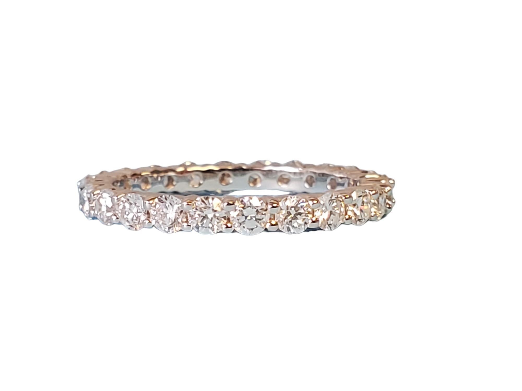 Listed is an unworn 18k white gold diamond eternity band. It features 1.38tcw FG VS round brilliant diamonds that go completely around the band. The ring is an unworn closeout piece, take advantage and save big money! This band comes in a size 6.5