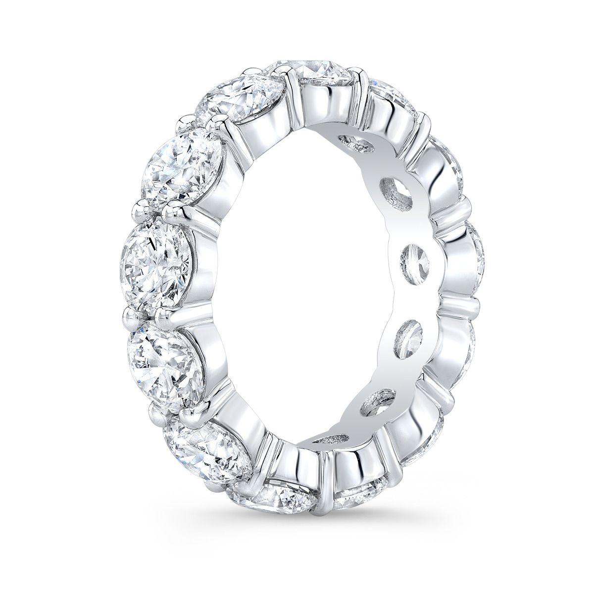 Diamond Eternity Band set with an impressive total weight of 7.15 carats of round diamonds, each meticulously certified by the Gemological Institute of America (GIA). Crafted with exquisite precision, this stunning eternity band features a shared
