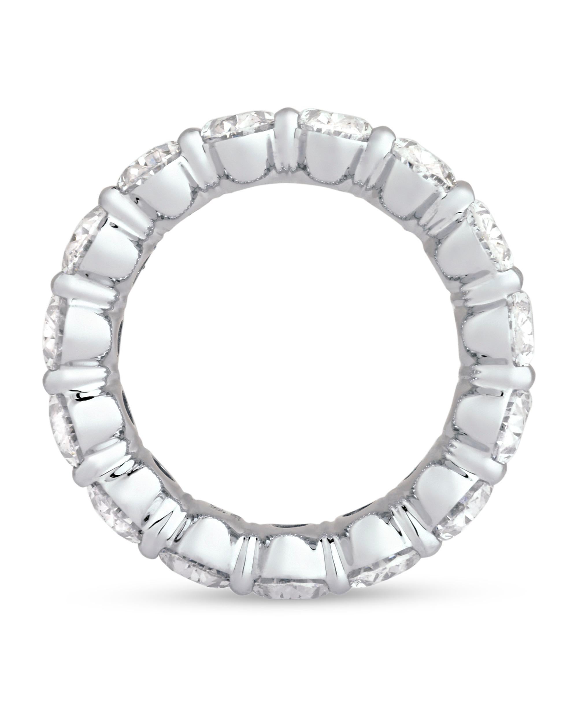 Classic and refined, this exquisite diamond eternity band is comprised of superb oval diamonds totaling 7.58 carats. Set in platinum, the diamonds shine in this timeless design.