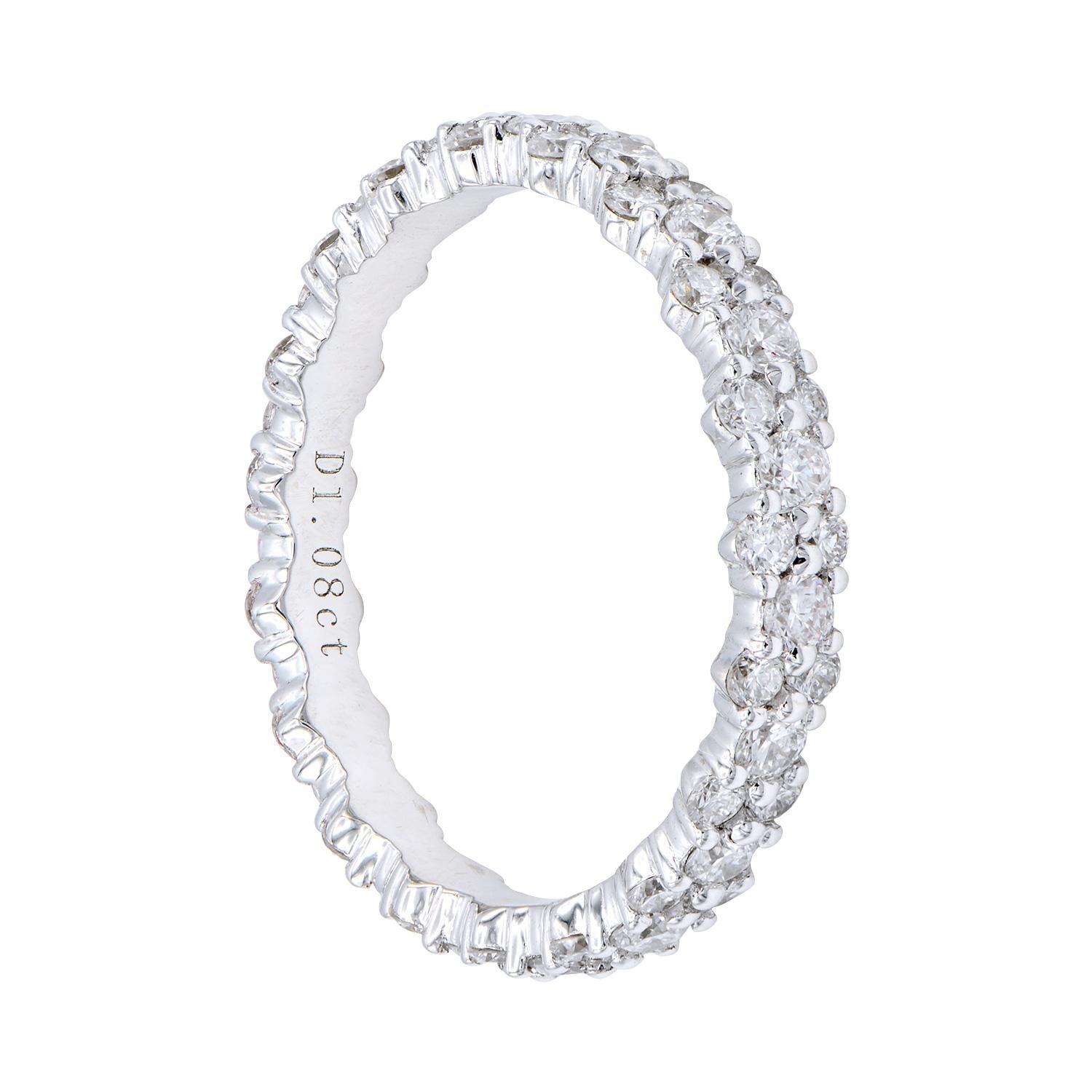 This diamond eternity band changes up the the classic straight row of diamonds by alternating between one big diamond and then two smaller diamonds stacked on top of each other. This ring is still classic and timeless just with a unique quality.