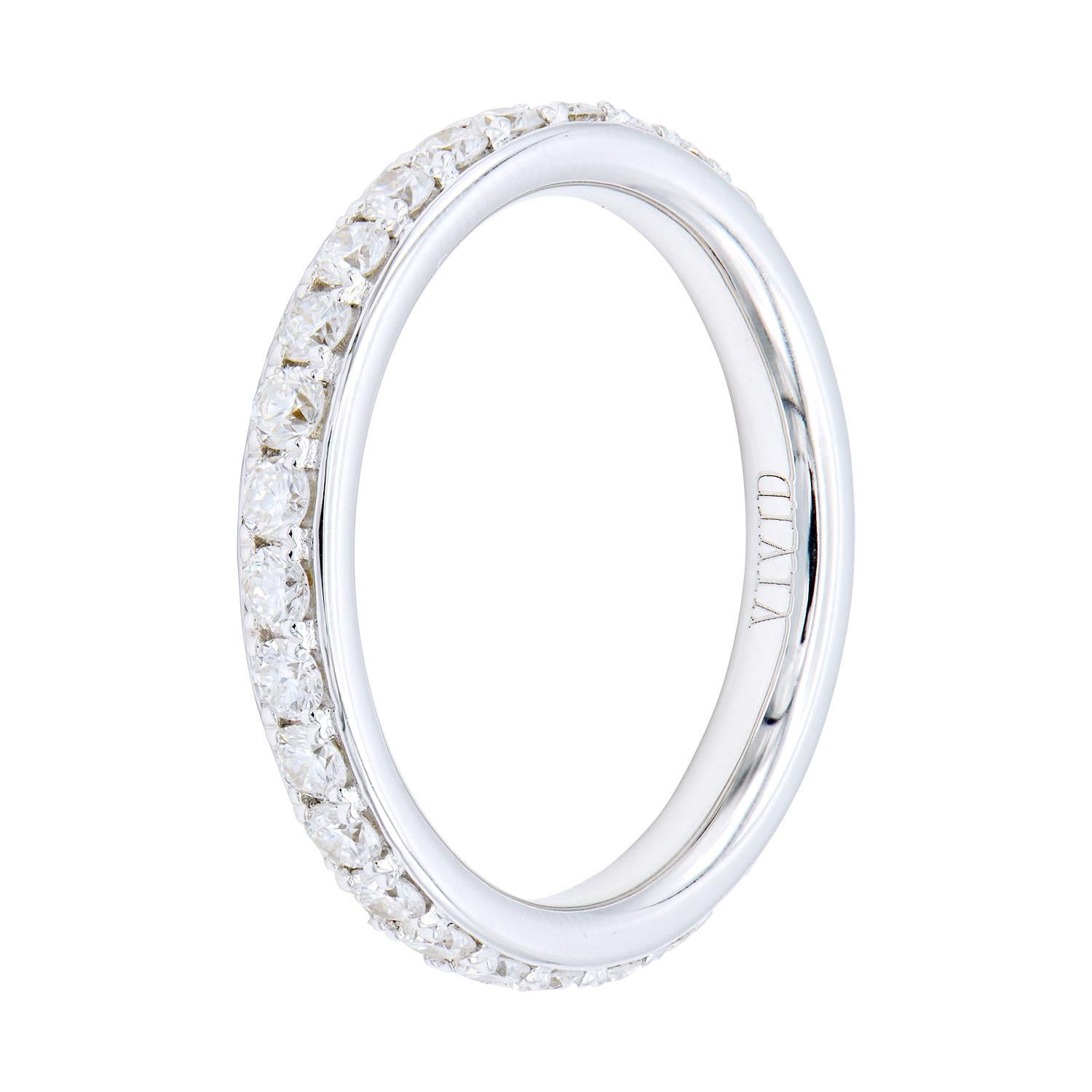 This is a beautiful, classic, and timeless ring that will be loved forever. This ring contains 30 round VS2, G color diamonds that total 0.98 carats that completely circle the ring. The diamonds are set in 3.6 grams of 18 karat white gold. This ring