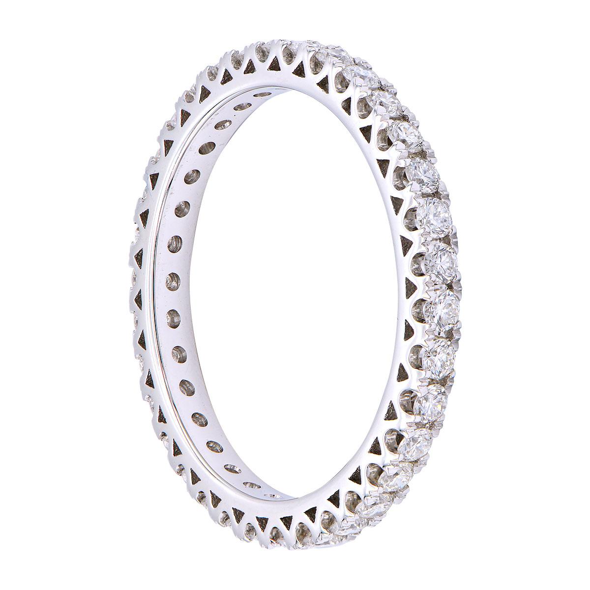 This gorgeous diamond eternity band has 33 round VS2, G color diamonds totaling 0.60 carats. They are set in 1.8 grams of 18 karat white gold. The gold prongs add a beautiful detail from the sides and it has a smooth comfortable fit. This ring is