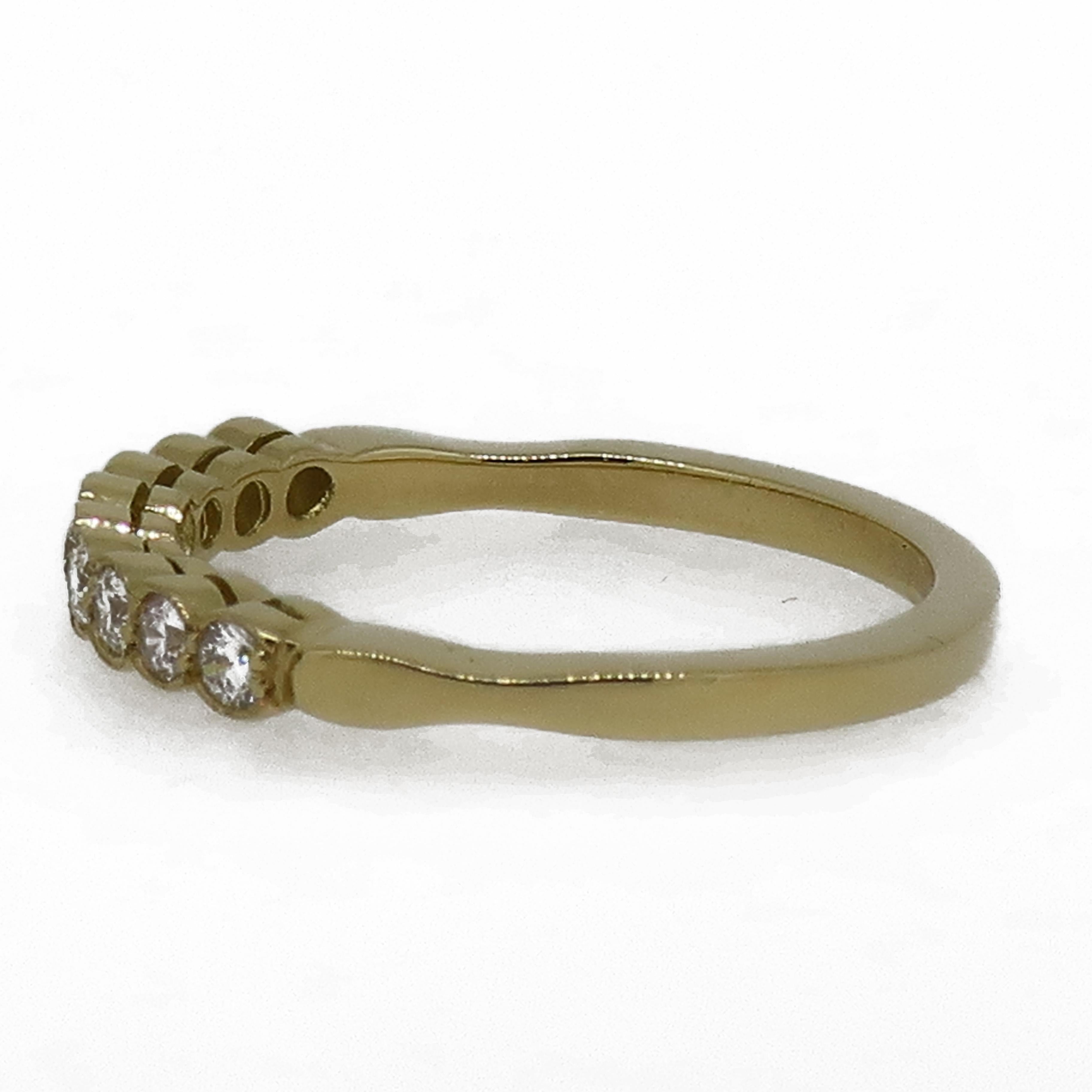 Diamond Eternity Band Ring 18 Karat Yellow Gold

A dainty diamond eternity ring. Consisting of nine white brilliant cut diamonds, weighing 0.30ct in total. All set in a delicate mill-grain setting in 18 carat yellow gold. It would make the perfect