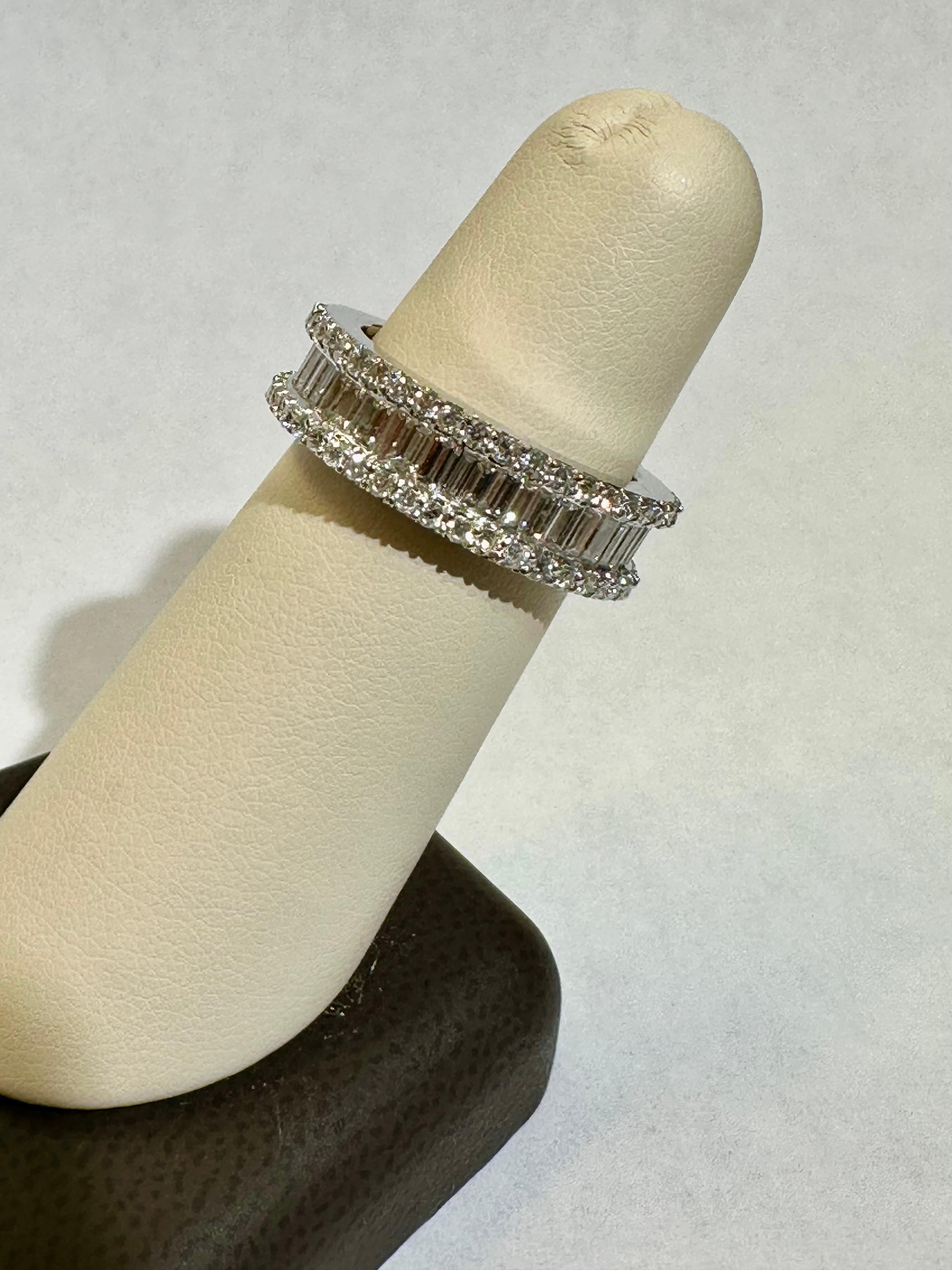  Diamond Eternity Band with Baguette & Round Diamonds  2.70 CT T.W. 18K W. G.

Description / Condition: New.  All jewelry has been professionally scrutinized and cleaned prior to being offered for sale. 

Manufacturer: Custom made by A Step Back in