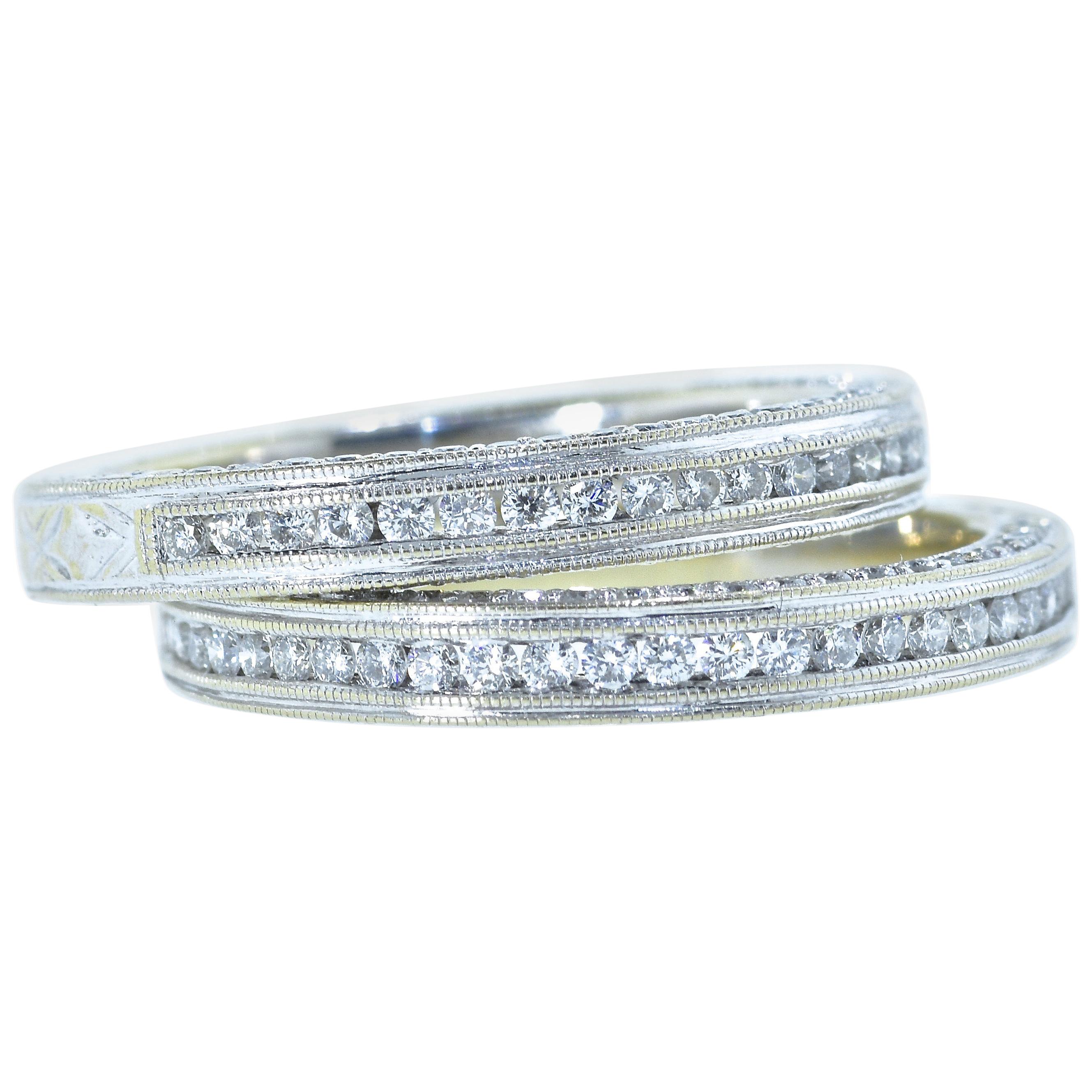 Diamond eternity bands with milgrained edges, they are 18K white and yellow gold in the back.  This pair of eternity bands with diamonds finely set on 3 sides,  each has 25 round brilliant cut diamonds across the top and 26 matching fine white