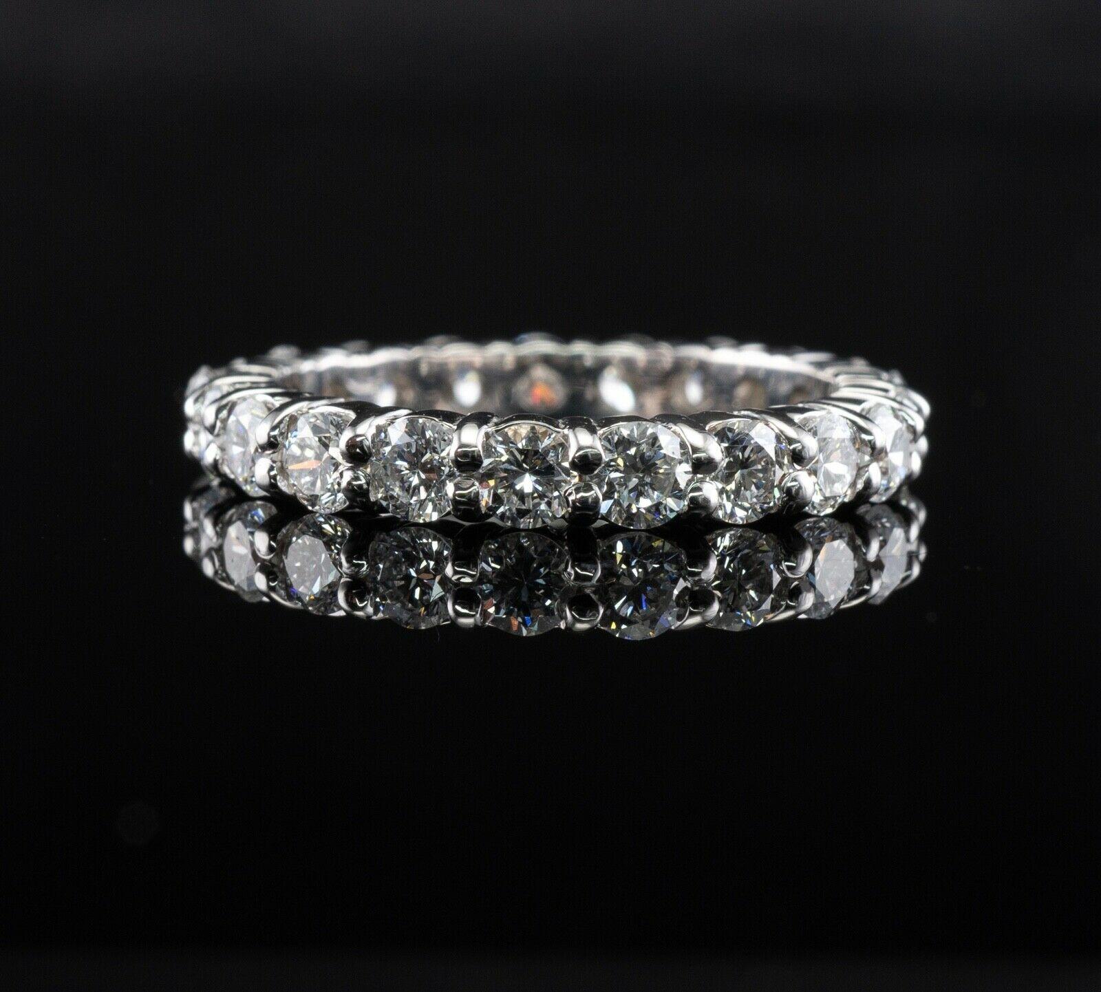 Diamond Eternity Ring Band 14K White Gold 2.10 TDW sz. 6.5

This gorgeous estate ring is finely crafted in solid 14K White gold (carefully tested and guaranteed). Twenty one round brilliant cut diamonds all go around, no beginning, no end. These