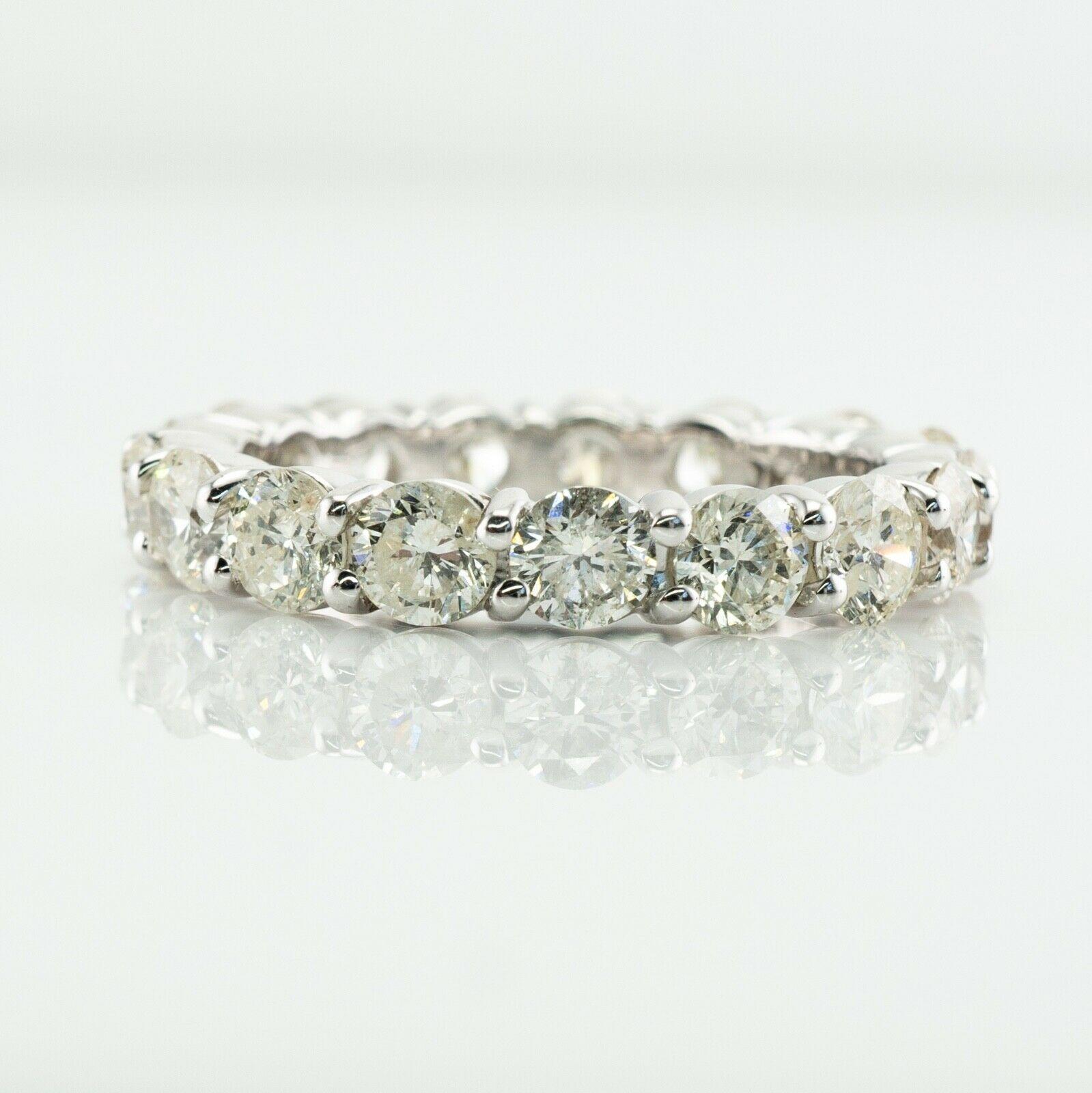 Diamond Eternity Ring Band 14K White Gold 3.40 TDW sz. 7
This gorgeous estate ring is finely crafted in solid 14K White gold (carefully tested and guaranteed). 17 round brilliant cut diamonds all go around, no beginning, no end. These diamonds total