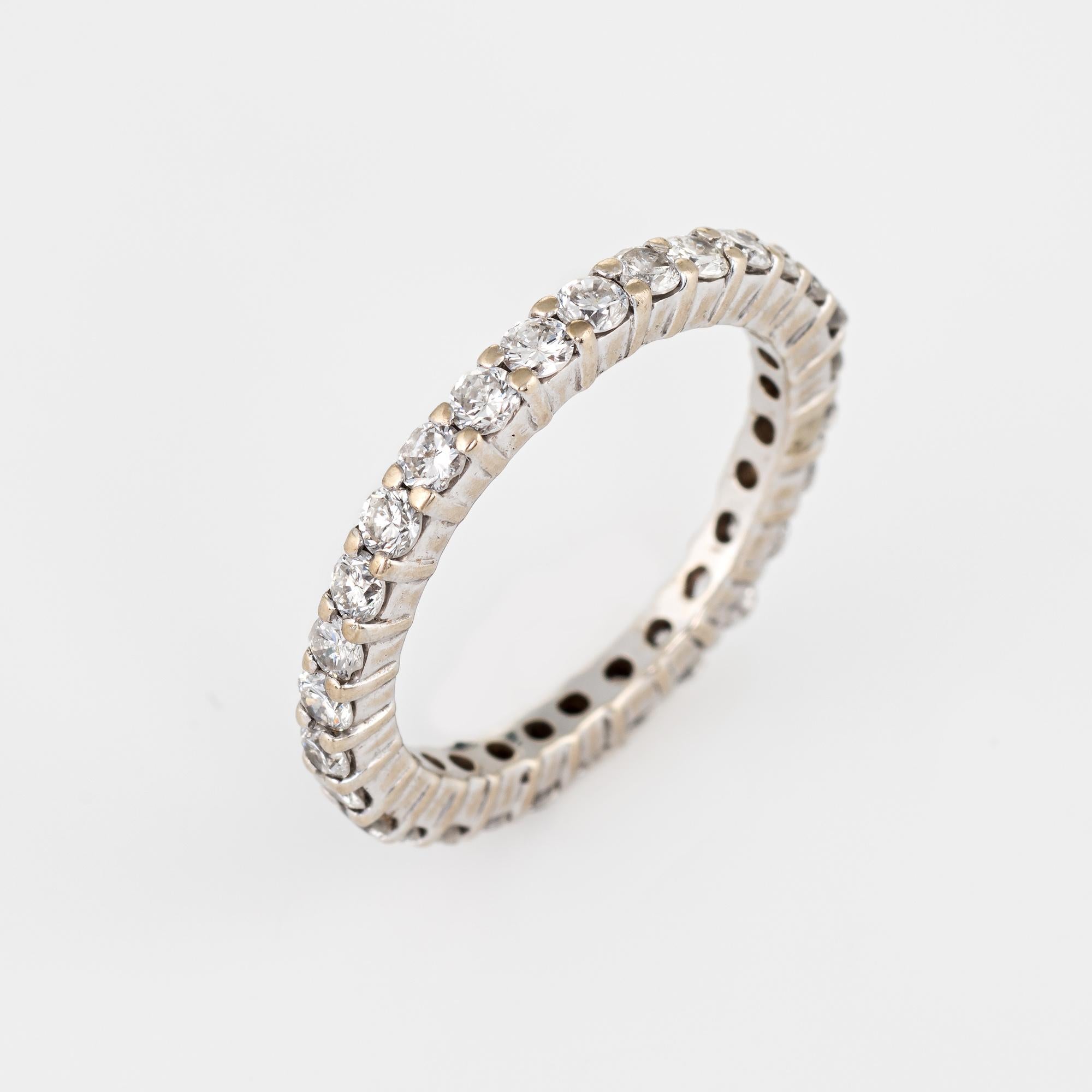 Elegant diamond eternity ring crafted in 14 karat white gold. 

28 estimated 0.03 carat round brilliant cut diamonds total an estimated 0.84 carats (estimated at I-J color and SI1-I1 clarity).

The ring epitomizes vintage charm and would make a