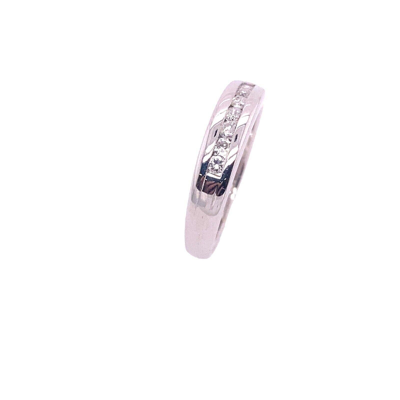 Diamond Eternity/Wedding Band Set with 0.20ct of Diamonds in 18ct White Gold

This wedding band is gorgeous and can be worn as an eternity ring. It features a row of 0.20ct diamonds set into a 18ct white gold shank. The diamonds are all round