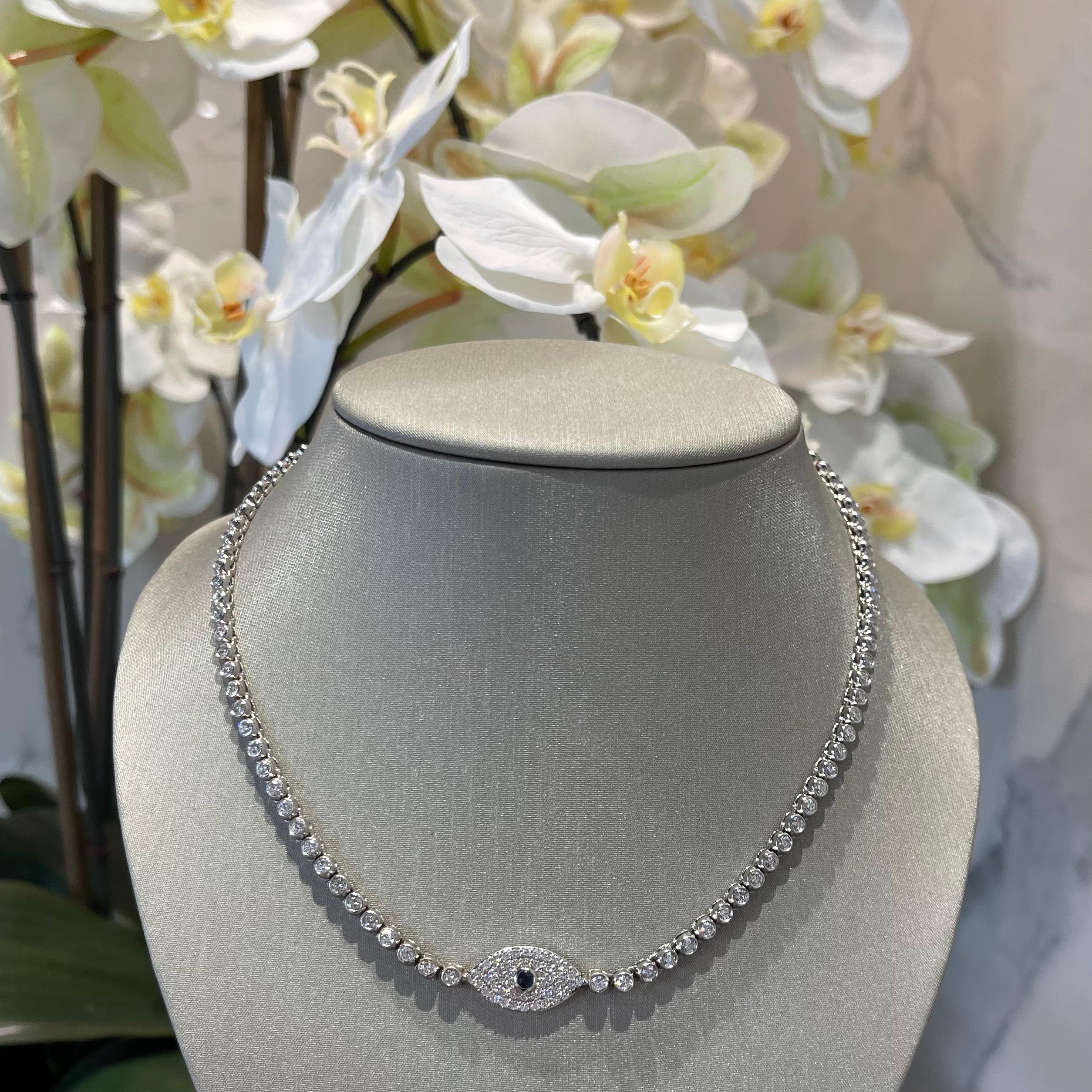 Style: Diamond Evil Eye Necklace
Metal: White  Gold 

Metal Purity: 14K
Stones: Diamonds​​​​​​​ and Sapphire

Diamond Clarity: VSI

Total Carat Weight: 7.6 ct 

Necklace Length: 15 in 

Total Weight: 27.4 g

Includes: 24 Month Brilliance Jewels