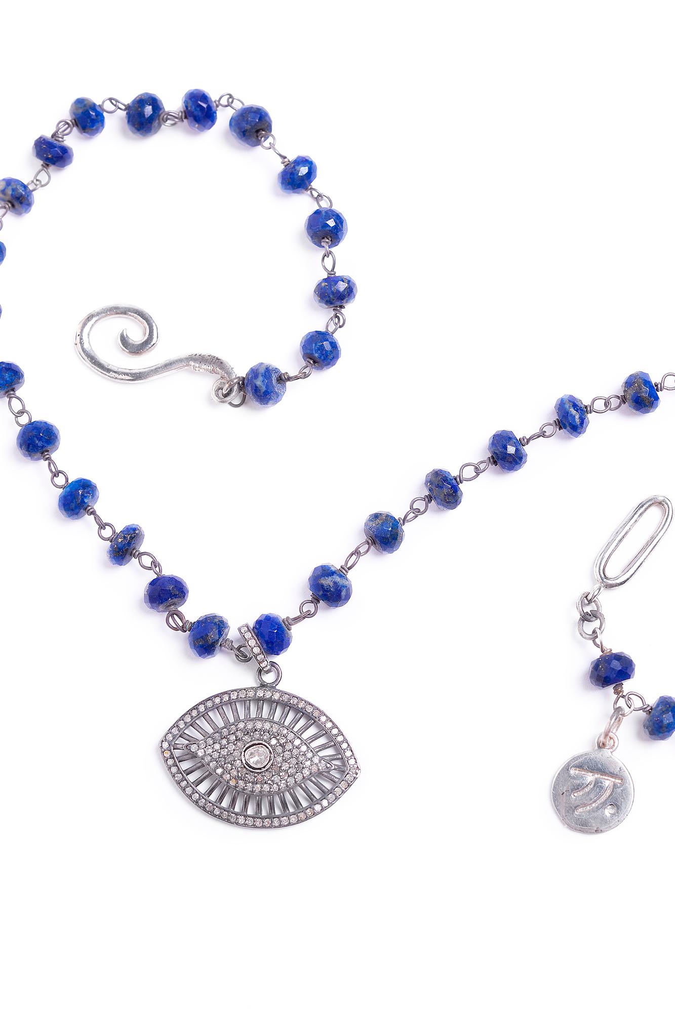 Properties
Evil Eye is a prominent symbol in the Moroccan culture.  The necklace is adorned with rich deep blue lapis.  The necklace is accented with a brilliant pave diamond evil eye.

Properties
The stones represent protective and mystic