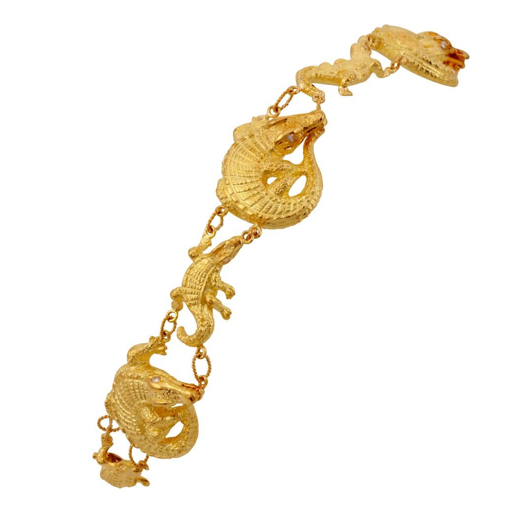 18k. Gold and Diamonds. Each large and small Alligator is individually lost wax cast in 18k gold, hand polished and then assembled with 18k hand made links. There are 16 round brilliant white diamond eyes. Box clasp with safety.  

This piece was