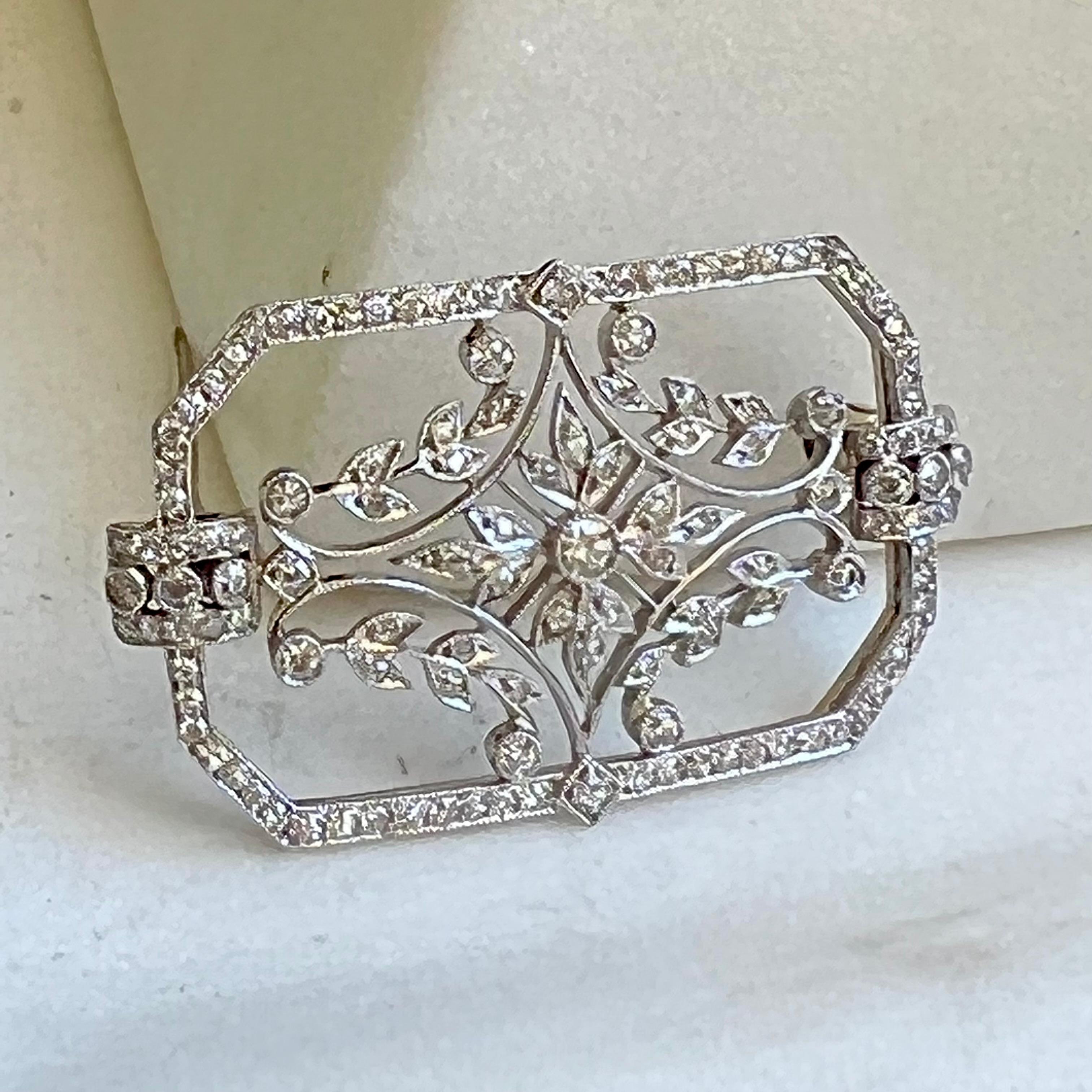 This stunning Diamond and platinum brooch  has 127  bright white diamonds ( total weight approximately 1.05 carats). The rectangle design is open filigree with a multitude of inlayed diamonds that sparkle and dance in the light. This brooch from the