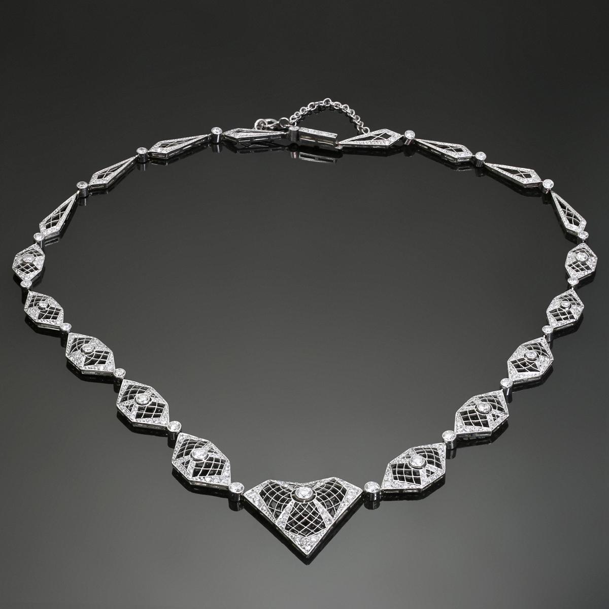 This magnificent retro evening necklace features a classic filigree design crafted in 950 platinum and 18k white gold and set with approximately 189 round G-H-I VS2-SI1 diamonds weighing an estimated 3.0 - 3.25 carats. Made in United States circa