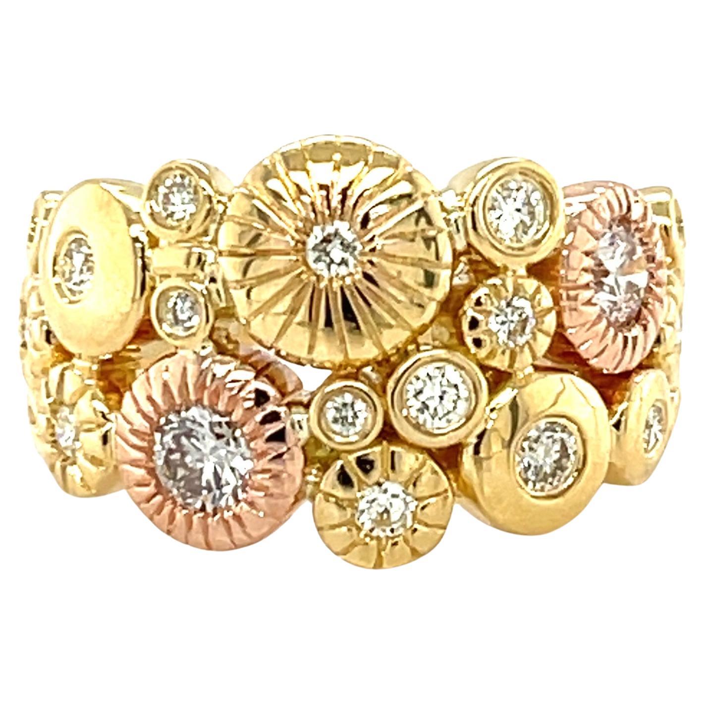  Sparkling round diamonds (.76 carats total) are set in various 18k rose and yellow gold frames in an eye-catching arrangement of sizes, widths and finishes, giving this ring a sophisticated yet modern, dimensional appearance. The overall look is