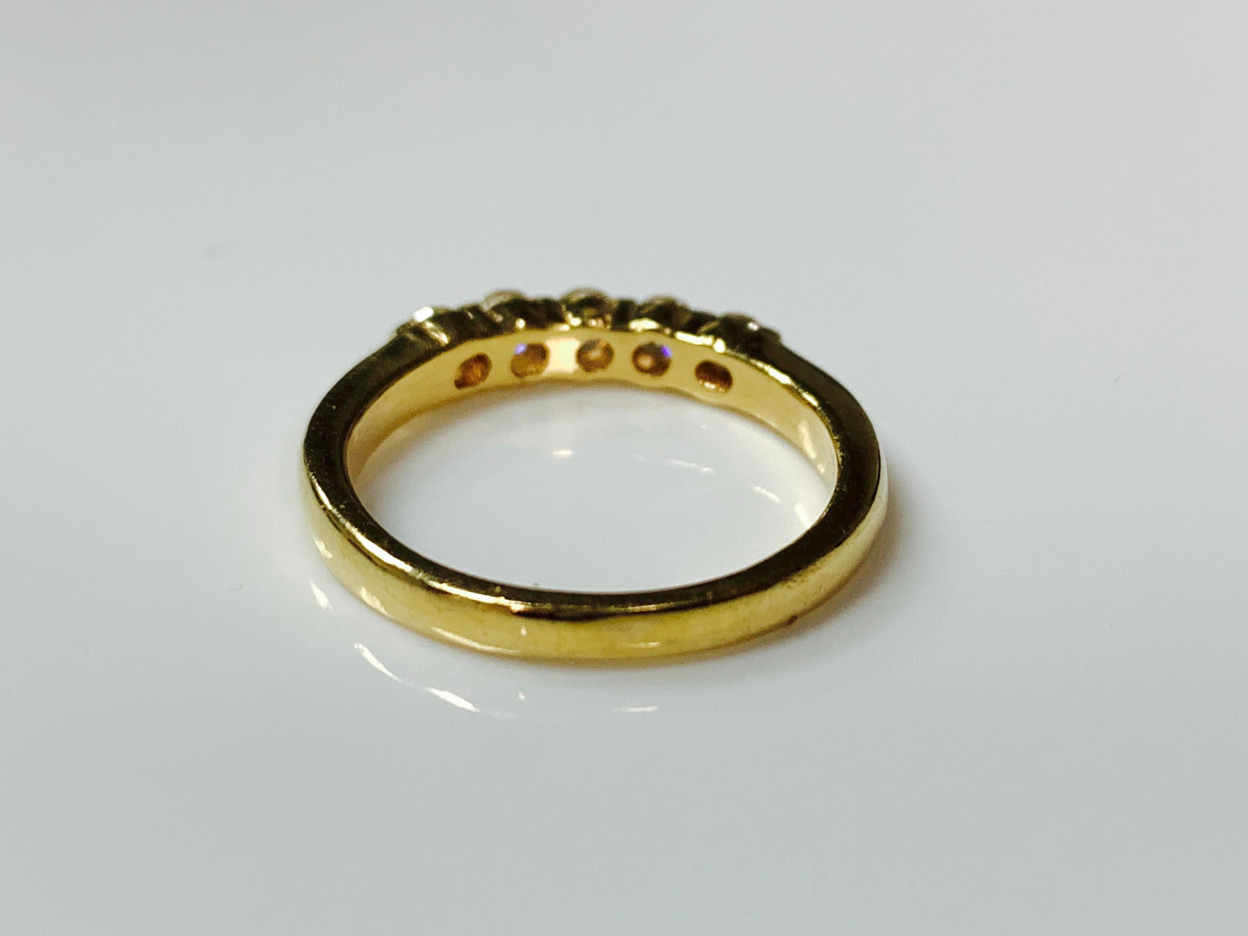 Diamond Five-Stone Ring In Yellow Gold Hand Crafted In 14k Yellow Gold. 
The details are as follows : 
Diamond Weight : 0.35 carat ( GH color and VS clarity ) 7pts each 
Ring Size : 5 1/4 
Metal : 14k yellow gold
