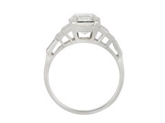 Diamond flanked solitaire ring, English, 1976.