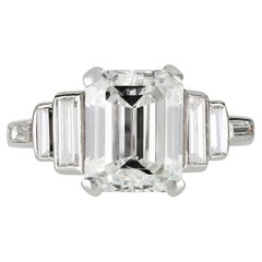 Diamond flanked solitaire ring, English, 1976.
