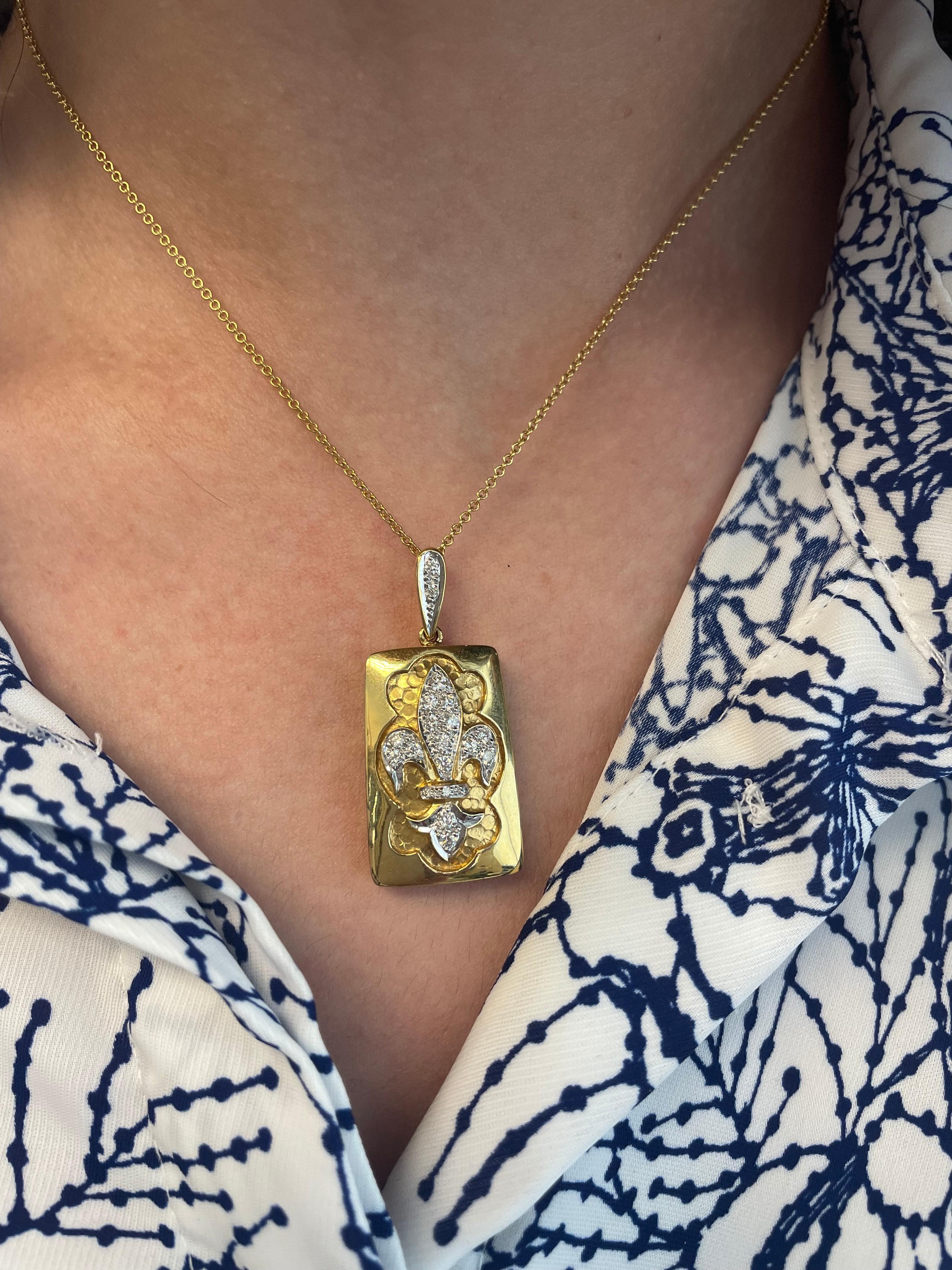 Fleur De Lis design diamond pendant necklace. 
0.40 carats of round brilliant diamonds, approximately G/H color and SI clarity. 18-karat yellow gold.
Accommodated with an up to date appraisal by a GIA G.G. upon request. Please contact us with any