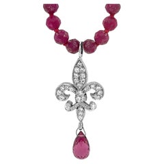 Diamond Fleur de Lis with Tourmaline Drop on 22" Necklace of Raspberry Rubies