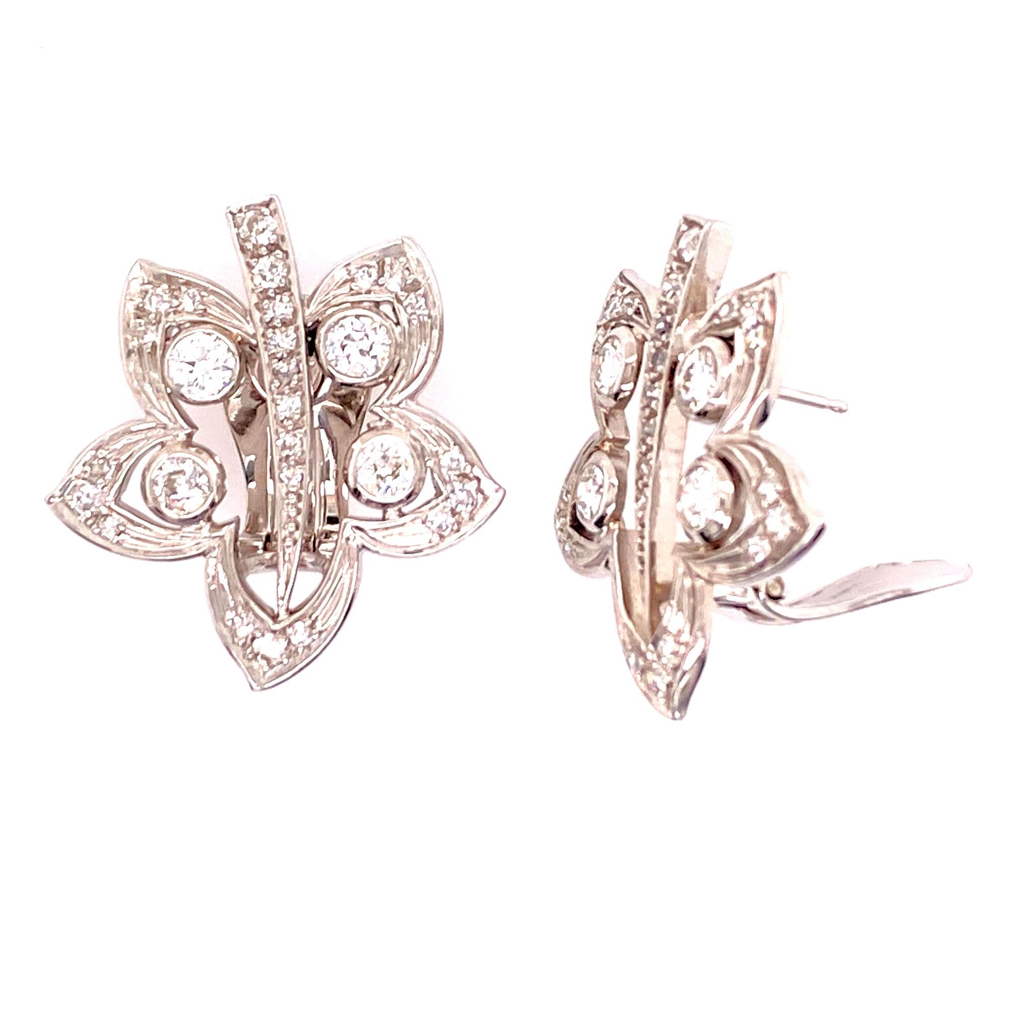 Elegant diamond floral earrings fashioned in 18 karat white gold. The earrings feature 54 round brilliant cut diamonds weighing 2.50 carat total weight. The diamonds are graded F-G color, VS clarity, and measure 1.0 inch in width and 1.10 inches in