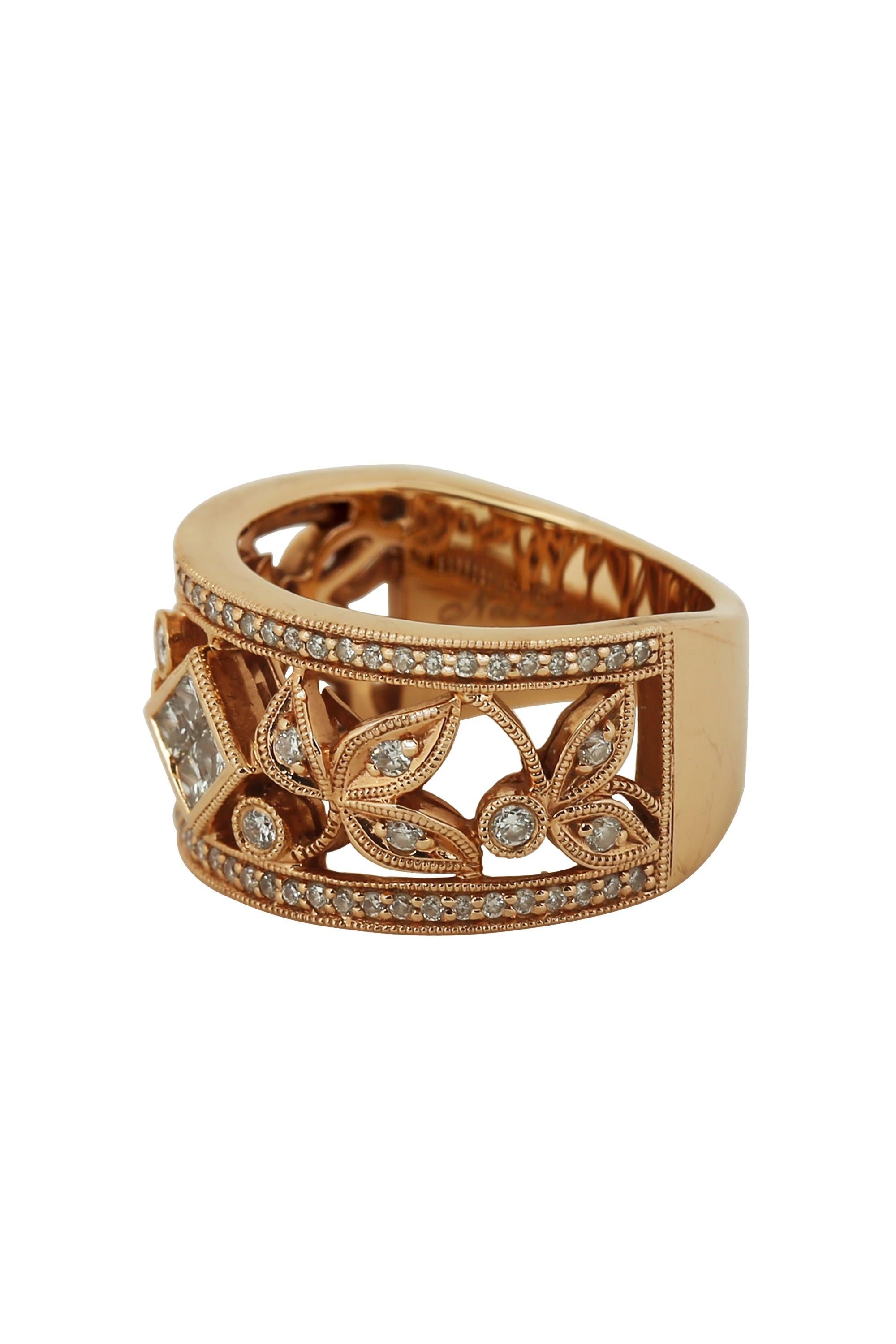 A 14 karat pink gold and diamond floral band ring by Neil Lane. This beautifully crafted ring features a graceful openwork design, beaded gold detailing and a center diamond shape cluster of princess cut diamonds. Total diamond weight is