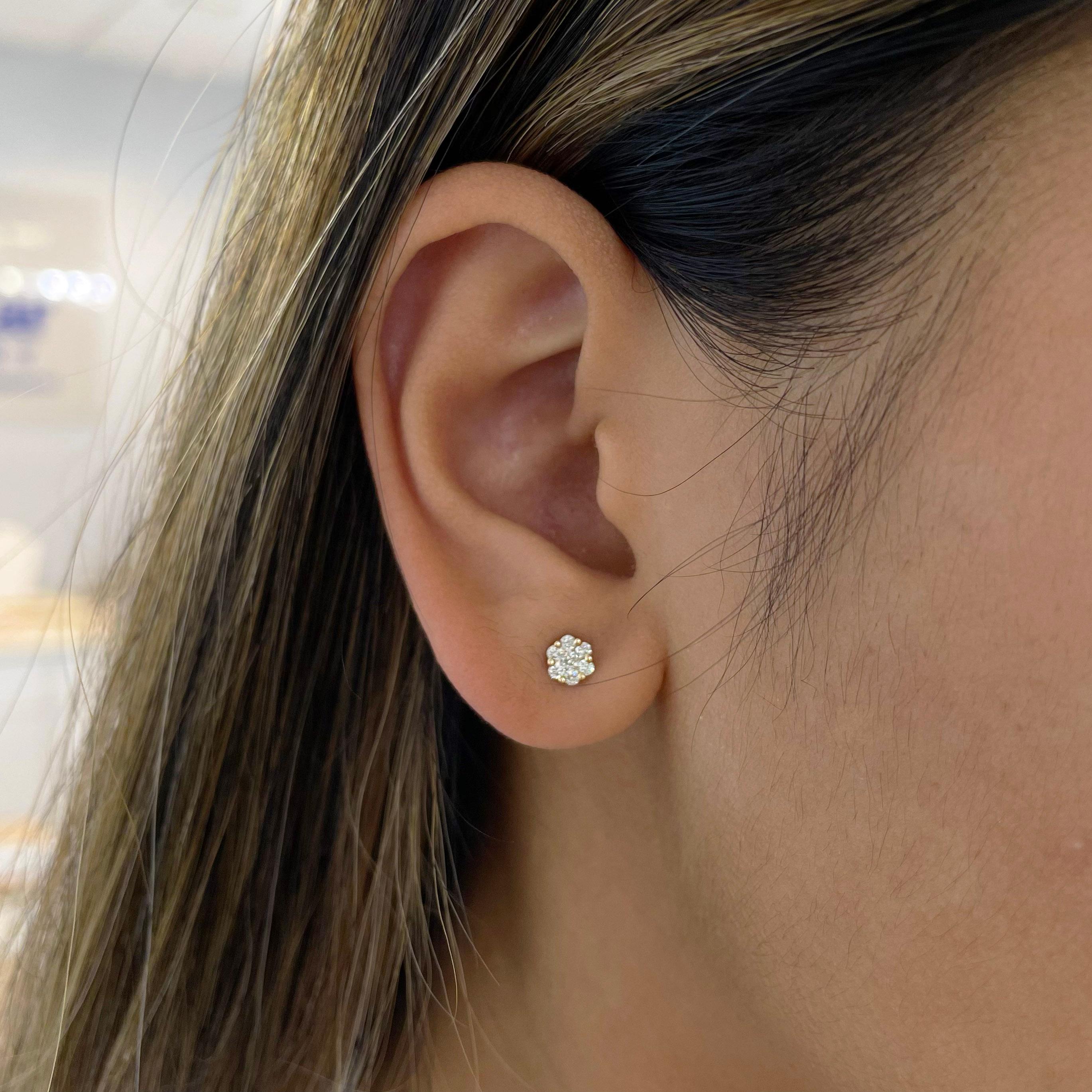 Diamond stud earrings make the best addition to any jewelry collection. These clustered diamond studs are the same size as 1/2 carat studs, made affordable by the petite floral cluster of diamonds. The layered design of the diamonds also adds to the
