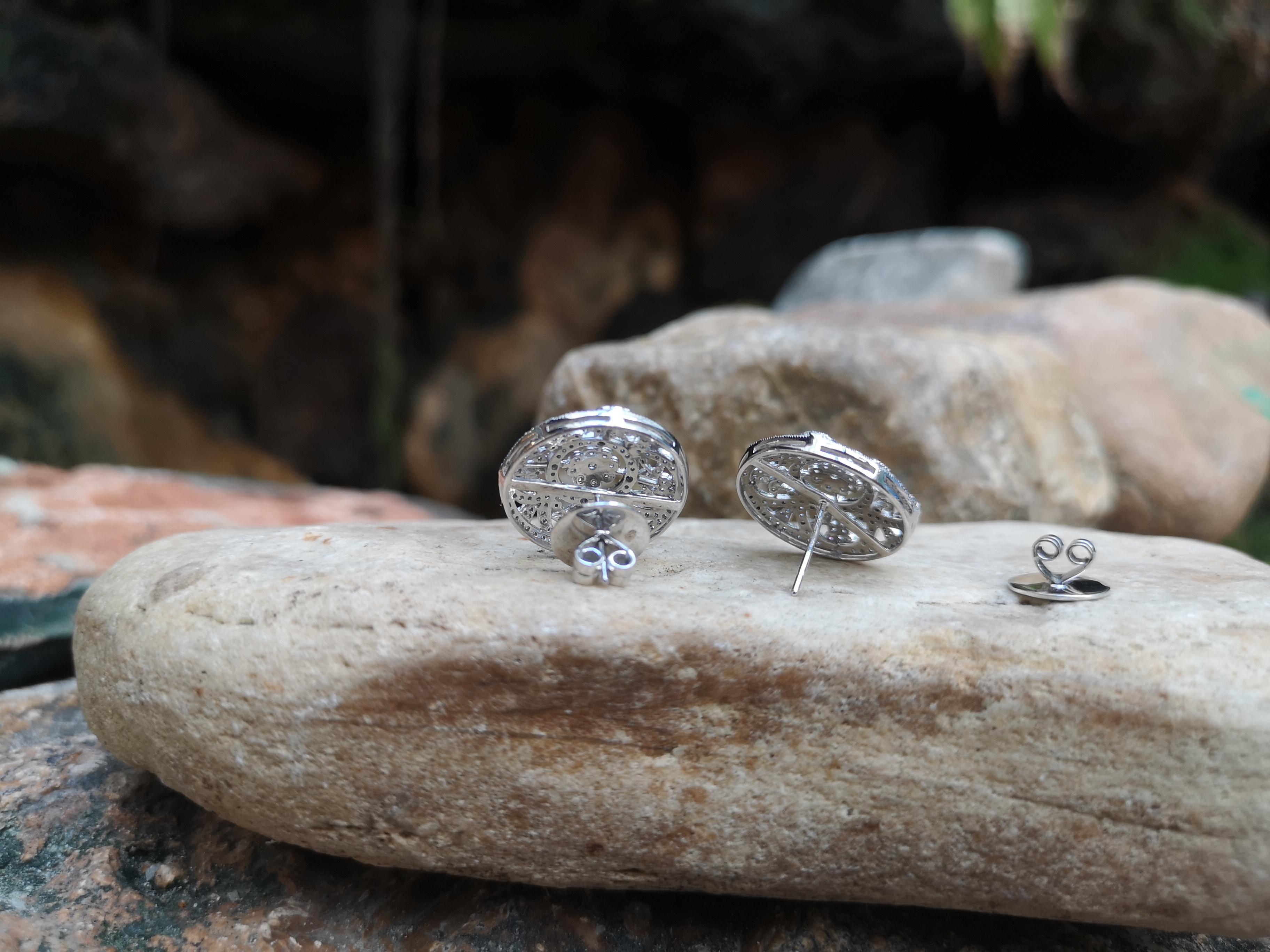 Women's Diamond Floral Earrings Set in 18 Karat White Gold Settings For Sale