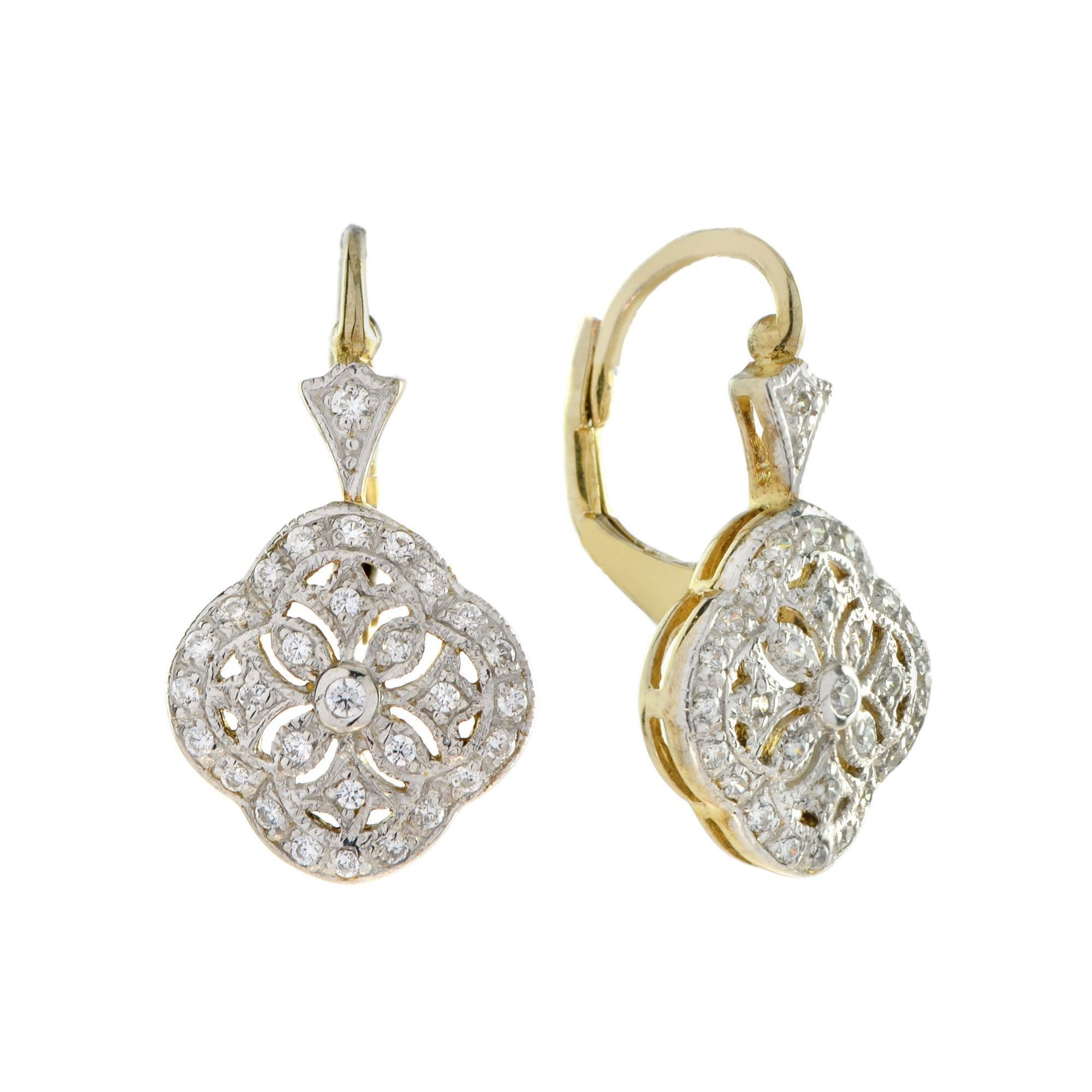 Step into timeless elegance with this stunning Edwardian style jewelry set. Featuring a delicate floral pendant and matching lever back earrings, each piece is adorned with shimmering diamonds. Intricate detailing reflects the glamour and