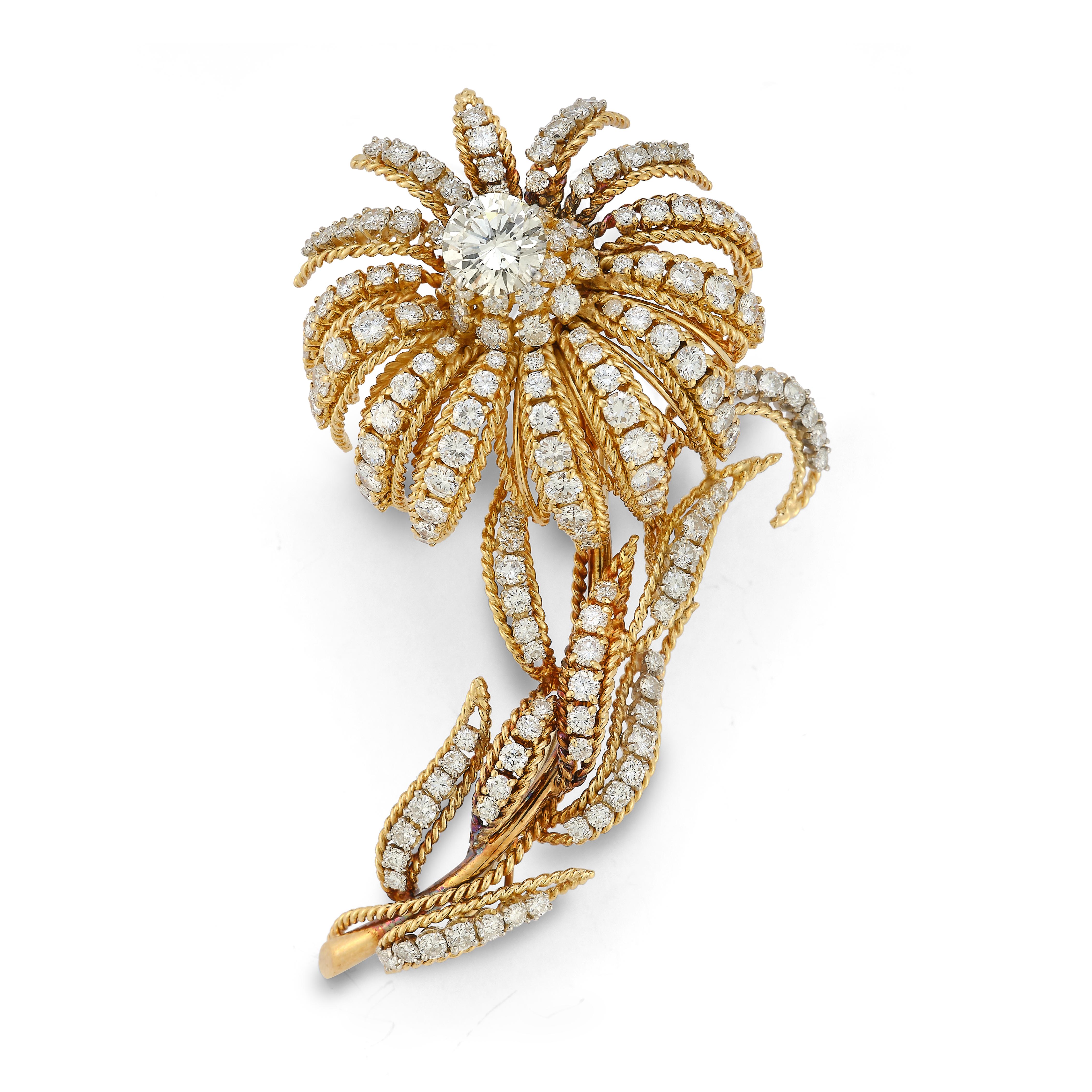 Round Cut Diamond & Gold Flower Brooch

1 center round cut diamond approximately 1.10 ct surrounded by 163 smaller round cut diamonds.

Diamonds total approximate weight: 12.84ct

Measurements: 2.75