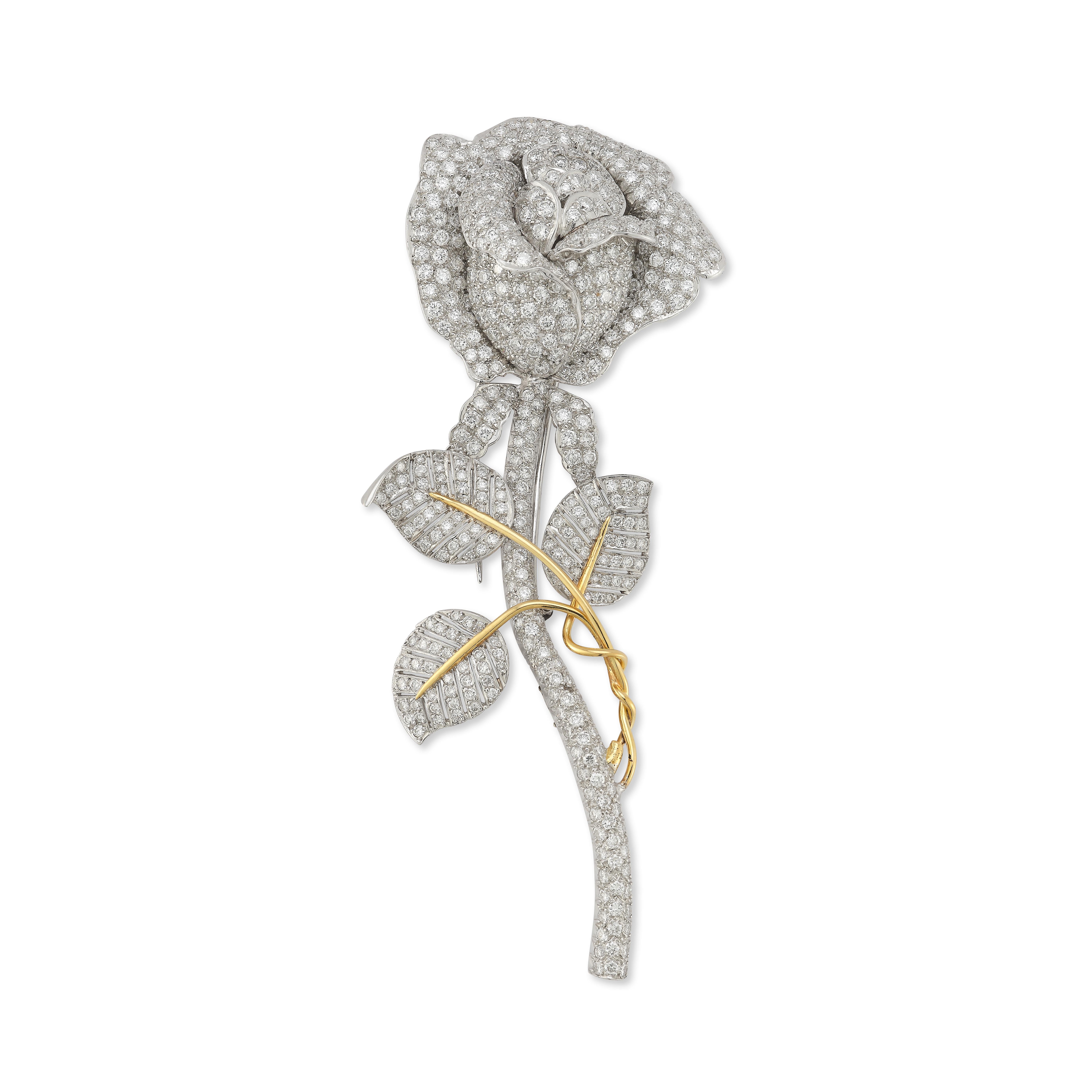 Diamond Flower Brooch

415 round diamonds approximately weighing 4.5 carat mounted in platinum and 18 karat yellow gold

Length: 4