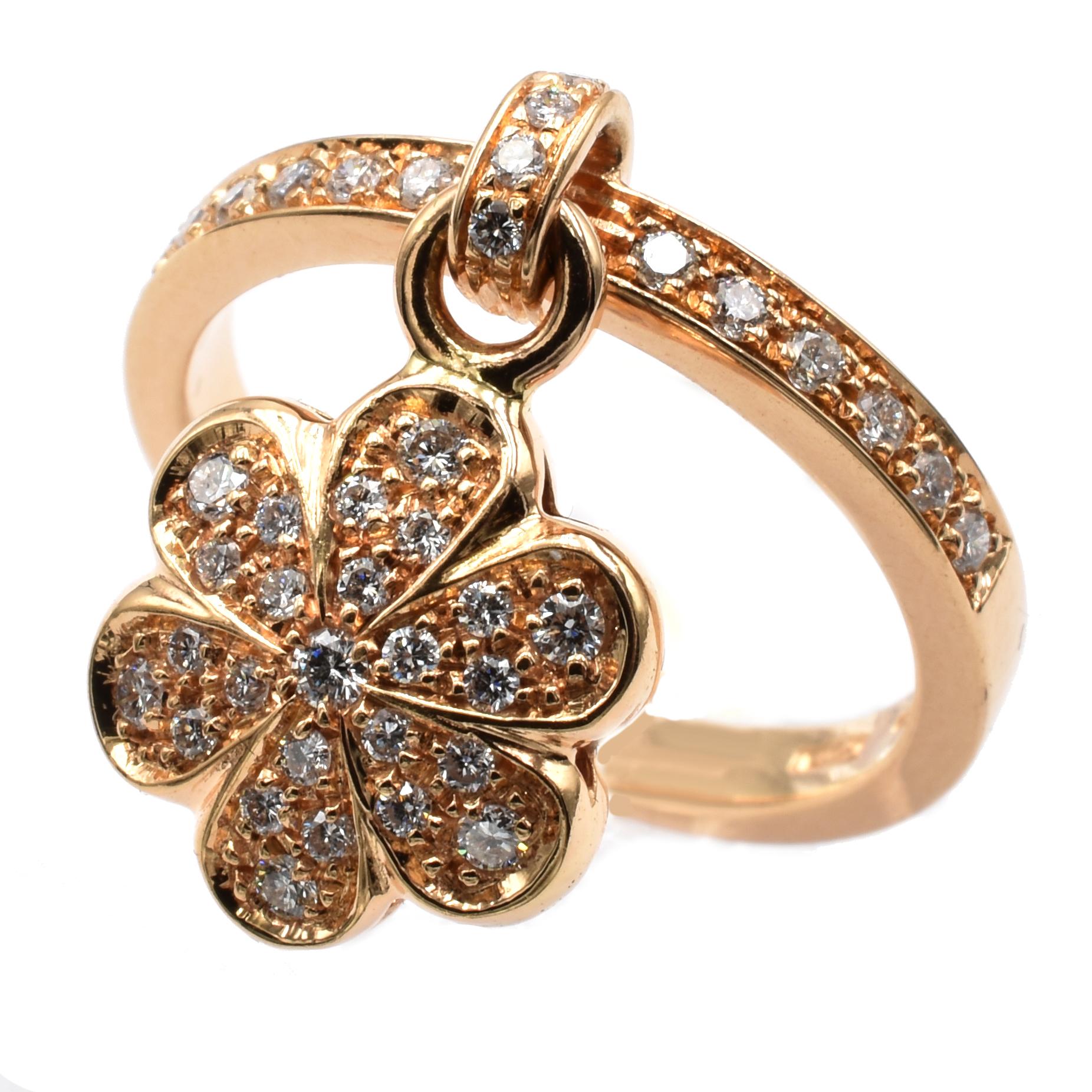 Gilberto Cassola 18 Kt Rose Gold Ring with Pendant Flower Charm. This Charm is set in both sides with White Diamonds and hangs freely on the ring.
A very Funny and Happy Piece that perfectly match with a Wedding Ring for an everyday use.
Handmade in