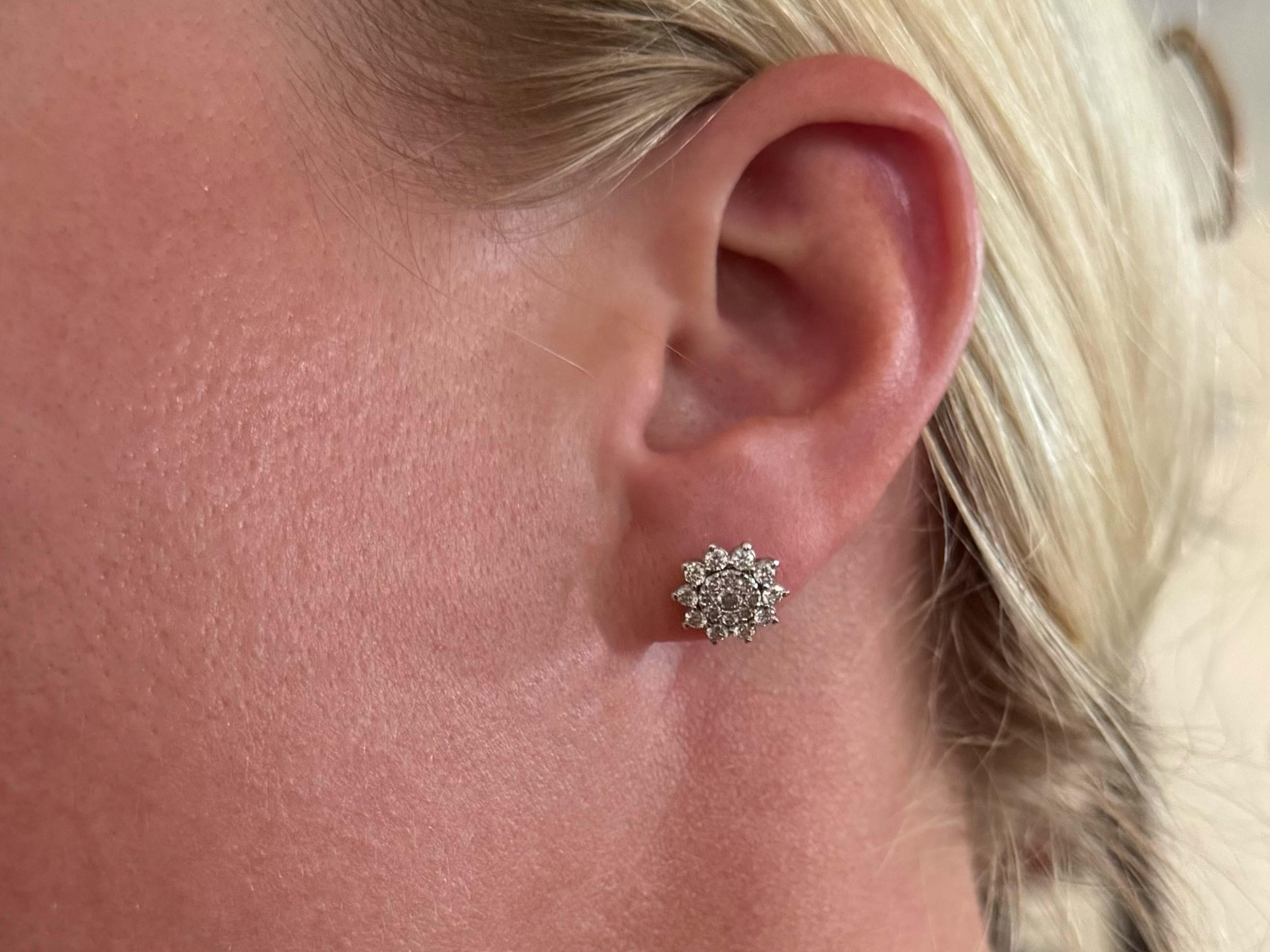 Earrings Specifications:

Metal: 14k White Gold

Total Weight: 2.9 Grams

Diamond Count: 38 brilliant cut

Earring Diameter: 10.3 mm

Diamond Carat Weight: ~ 1.00 carats

Diamond Color: G

Diamond Clarity: VS1-SI1

Condition: Preowned,