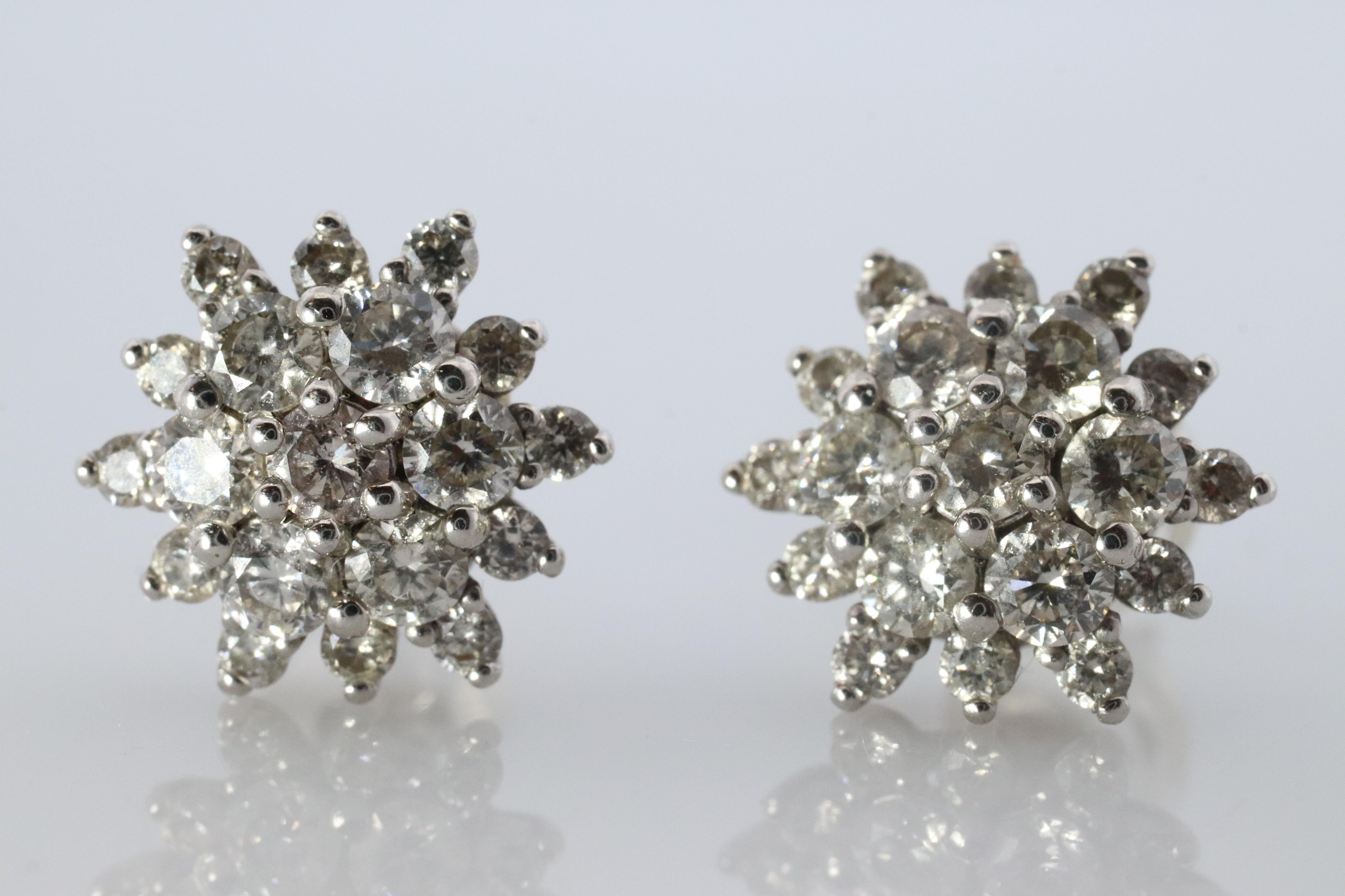 Stunning Diamond Cluster Earrings.

PT900 Platinum with 1CTW total diamonds
Comfortable Silicone Pushbacks

Condition: Shows little to no signs of wear.

Details:
PT900 Platinum 
2.5 grams total weight
10 mm cluster
0.50CT each earring
Est. SI