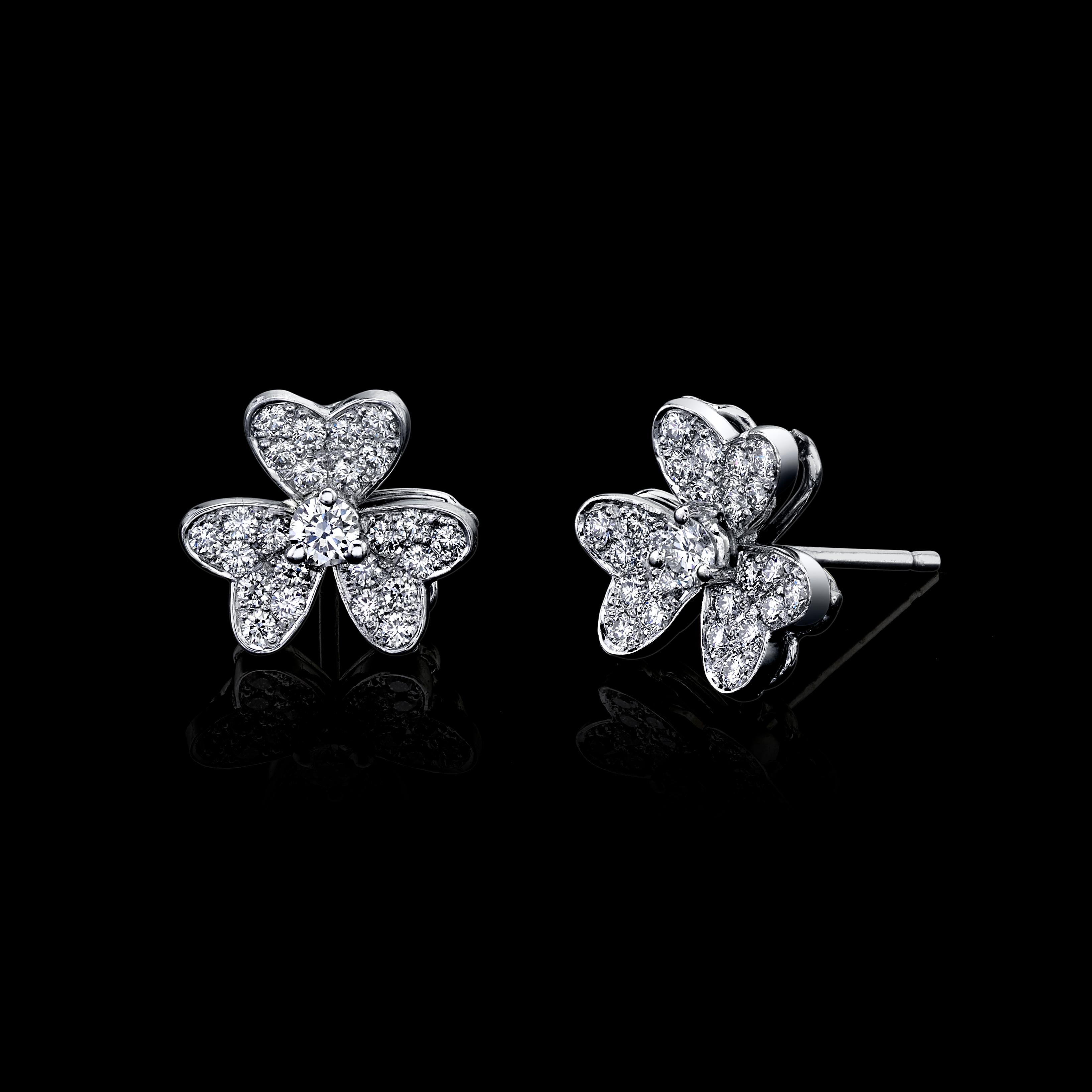 DIAMOND FLOWER EARRINGS 18K WHITE GOLD

Center Stone Total Carat Weight 0.20 carat 

D/E  Color VVS/VS Clarity

Micropave Round Brilliant Diamonds 0.60 carats

D/E Color VVS/VS Clarity

0.80 CTW of all Diamonds

Set in 18K White Gold

Shipped in a