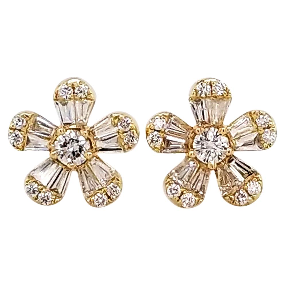 Cute and charming stud earrings embellished with invisibly-set diamonds designed as flowers.
Made in 14k yellow gold.
20 baguette shape diamonds weighing 0.60 carats. 
22 round diamonds weighing 0.37 carats. 
Total weight of diamonds is 0.97