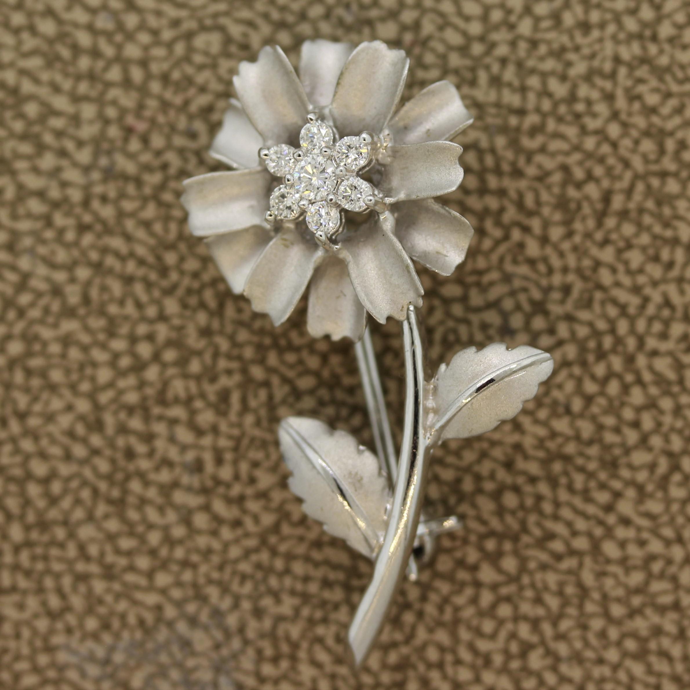 A cute and wearable gold flower pin. It features 7 round brilliant cut weighing a total of 0.25 carats. Set in 18k white gold, easy to wear with any outfit.

Length: 1.25 inches