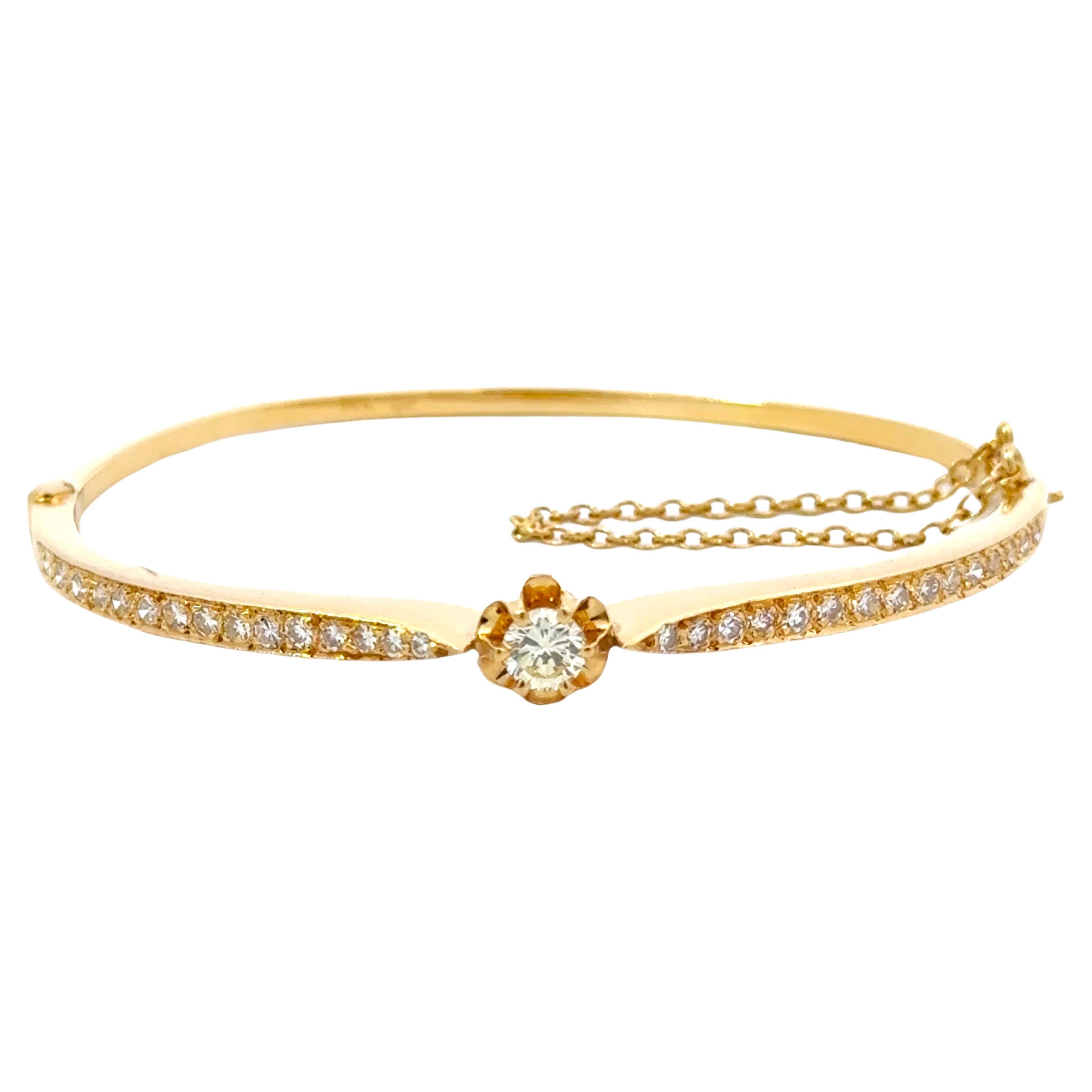 Bracelet jonc à charnières fleur en or jaune 14 carats et diamants