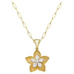 Collier pendentif fleur en or jaune 14 carats et diamants