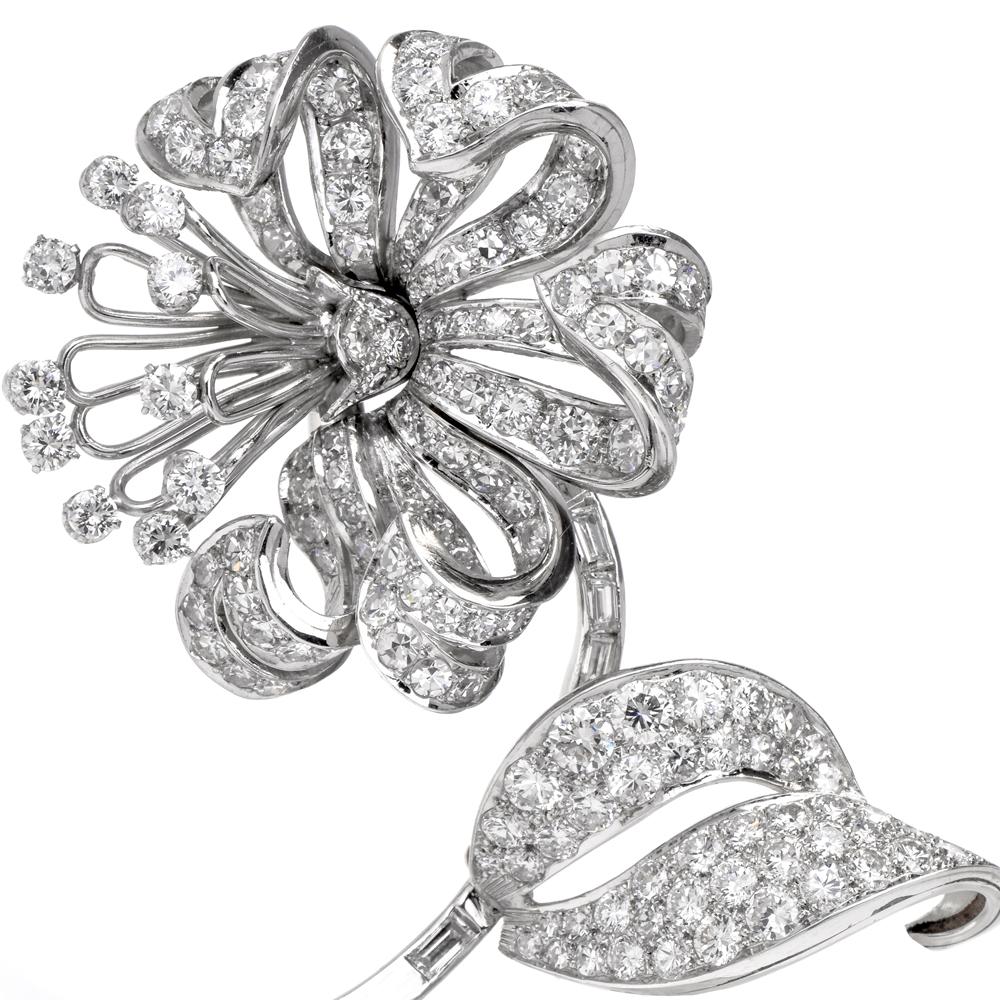 This charming antique brooch pin circa 1940s is crafted in solid platinum. A great item for someone very spacial, Featuring a gorgeous flower with leaves covered with approximately 145 genuine round cut vibrant diamonds approximately: 10.15 cttw,