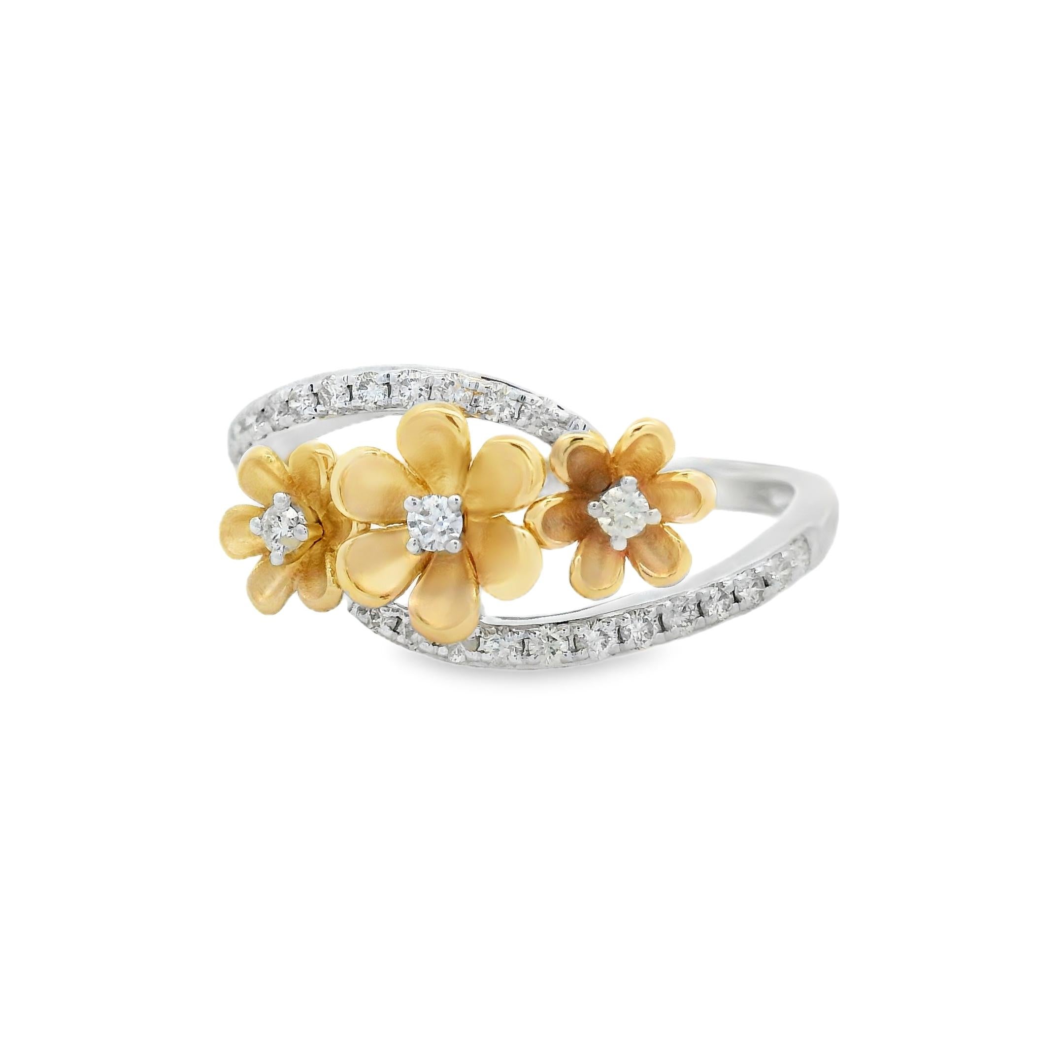 This charming floral diamond ring blends warm 14K yellow gold petals with the crisp brilliance of white diamonds, creating a refined two-tone aesthetic. Three sculptural flowers bloom across the finger, each centered with a round diamond and framed