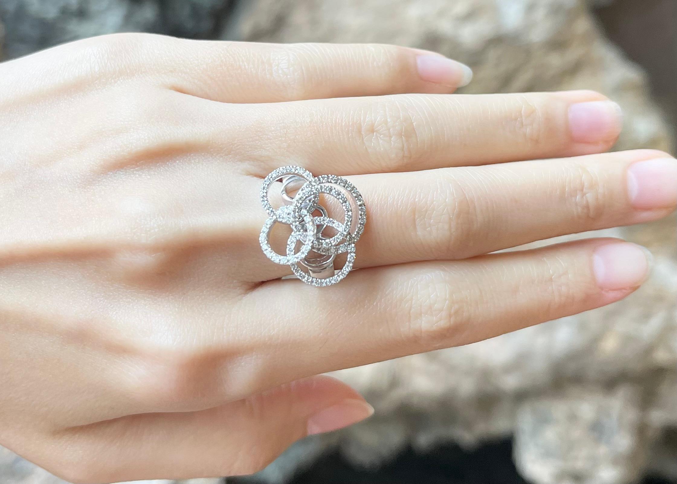 Contemporary Diamond Flower Ring set in 18K White Gold Settings For Sale