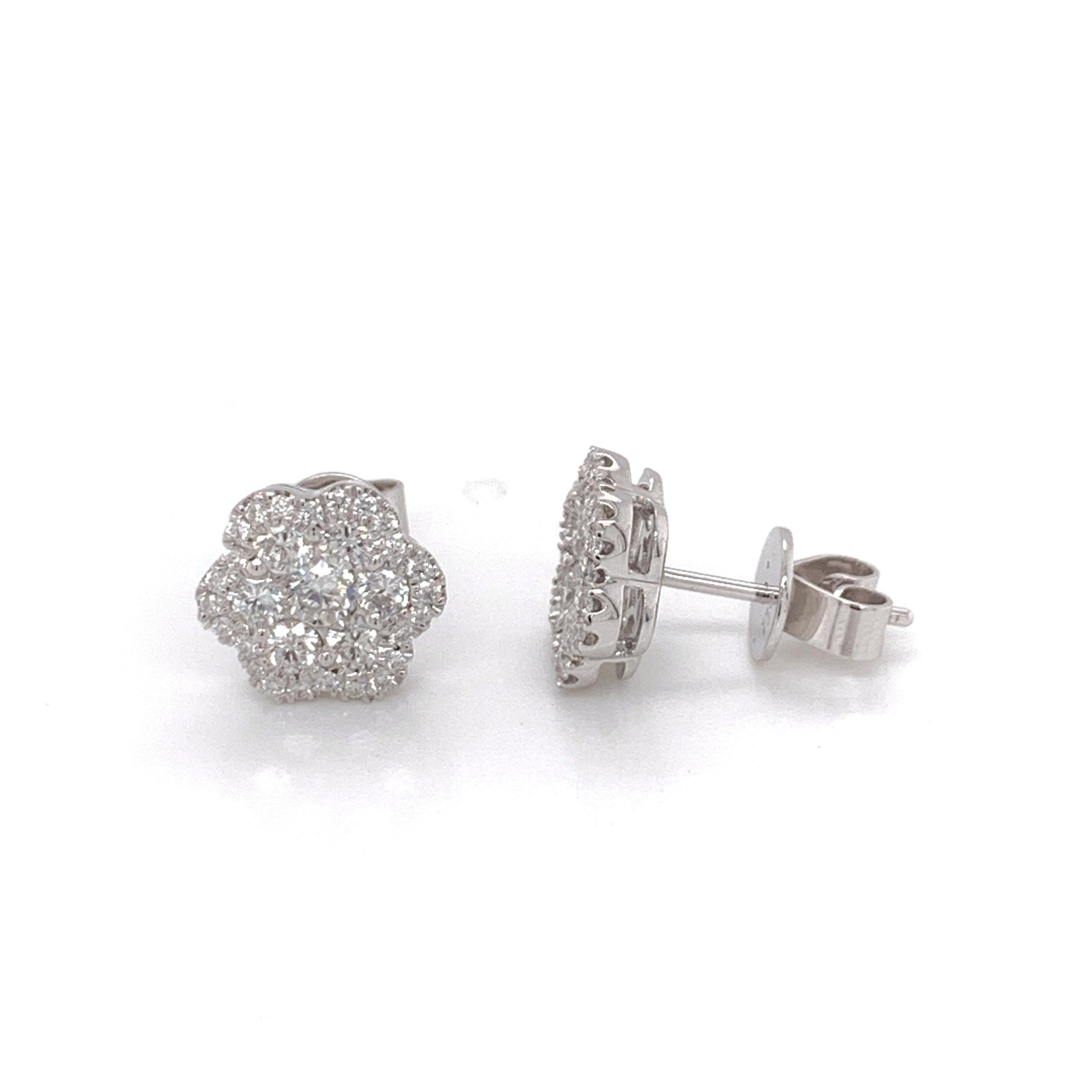 Diamond Flower Stud Earrings made with real/natural brilliant cut diamonds. Total Weight: 0.84 carats, Diamond Quantity: 62 round diamonds. Color/Clarity: H1. Set on 18 karat white gold, push back setting.