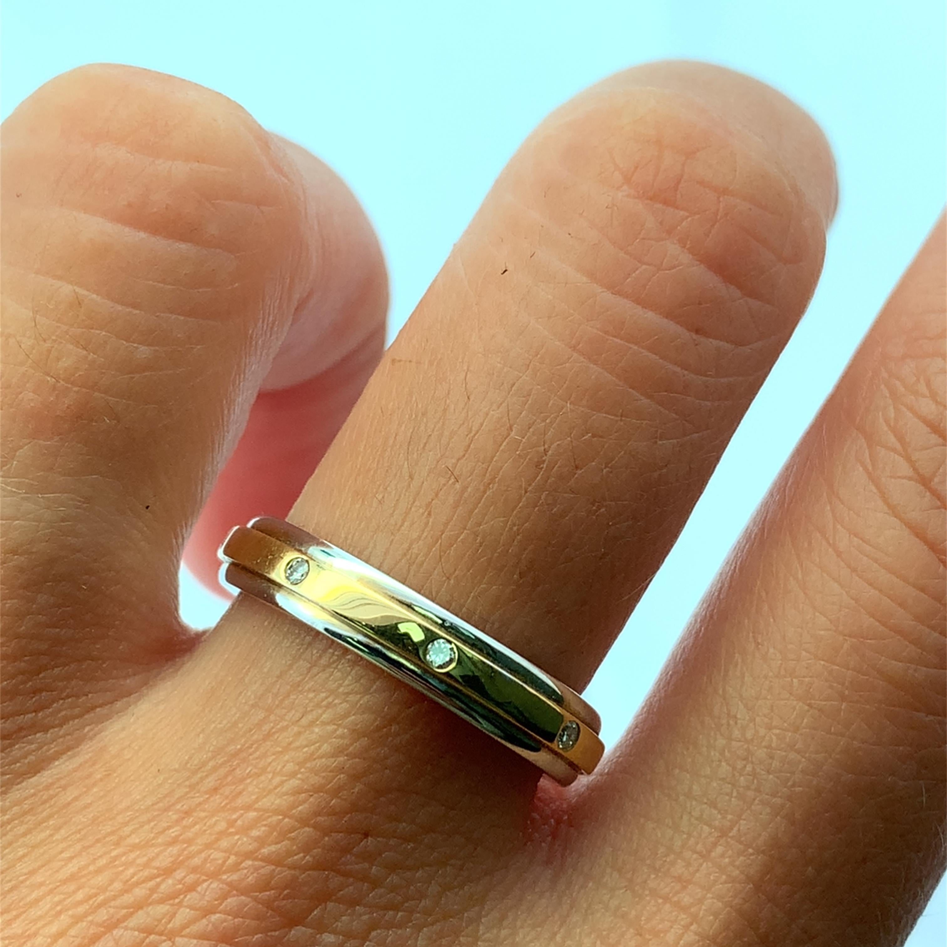 Erhöhen Sie Ihren Stil mit diesem exquisiten zweifarbigen Diamant-Ehering, der fachmännisch aus glänzendem Gelbgold gefertigt ist. Breite ca. 4 mm, Gewicht 5,5 g, insgesamt 8 Diamanten F VS 0,25ct. Dieses zeitlose Schmuckstück zeichnet sich durch
