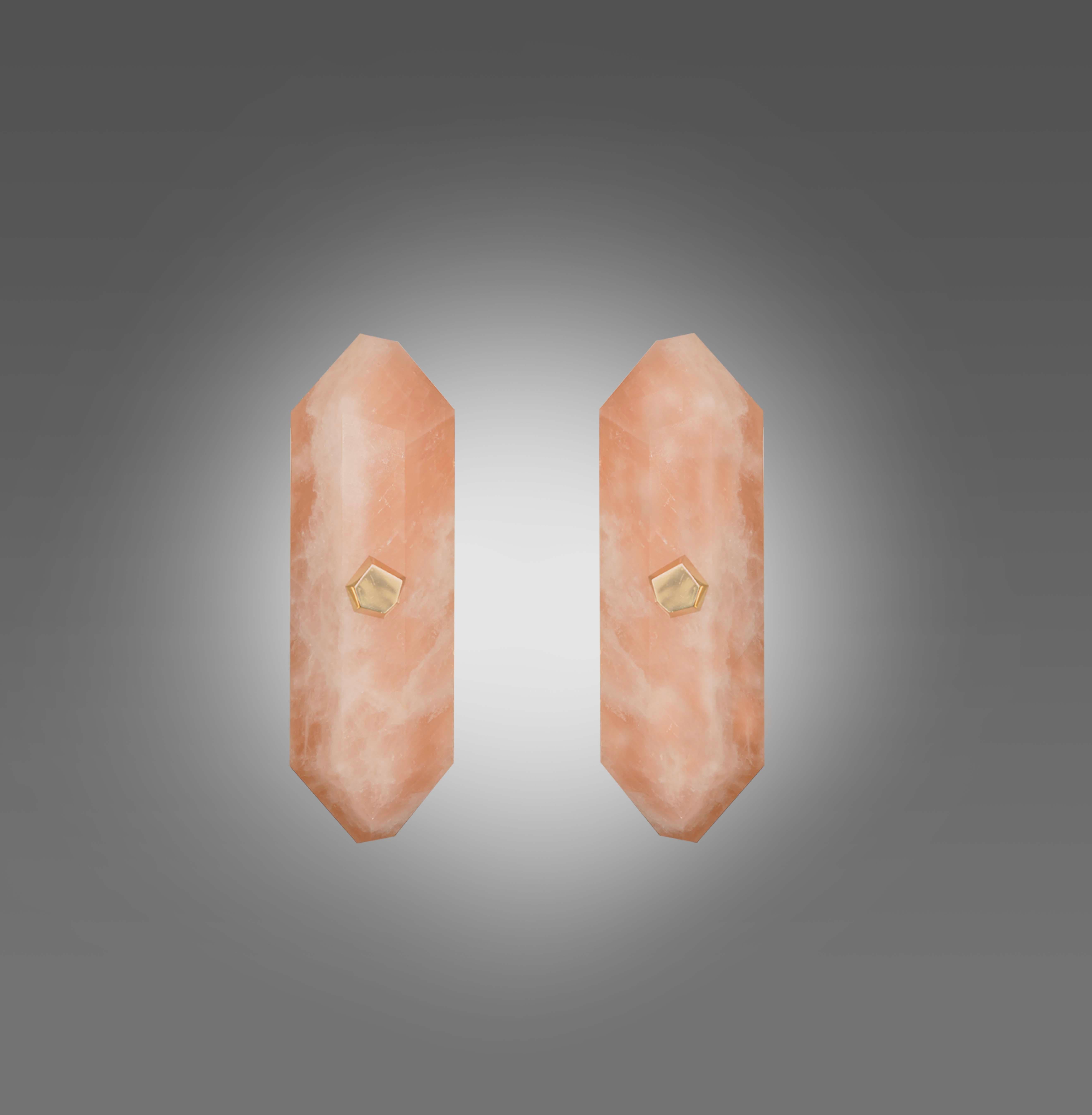 Pair of fine carved diamond from rose quartz sconces with the polish brass mounts.  Created by Phoenix Gallery NYC. 
Each sconce installed with two sockets, 40 watts max each socket, the total of 80-watts maximum for each sconce. 
Custom size upon