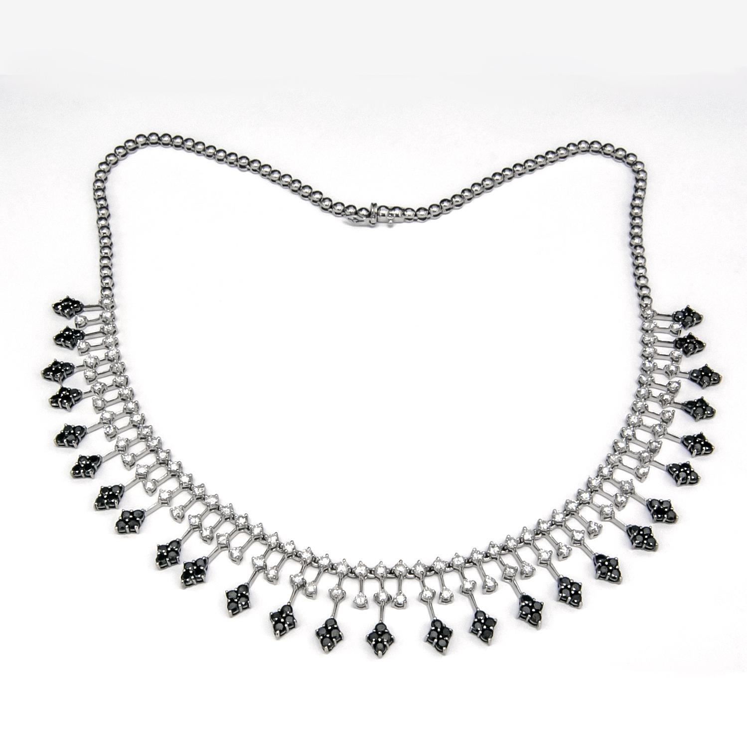 Elegant and sleek the most beautiful diamond fringe necklace created in 18 karat white gold with 5.30 carats of white diamonds (G-H color, SI1 clarity) and 4.70 carats of black diamonds. The necklace is silky soft and flexible and is 17-1/4 inches